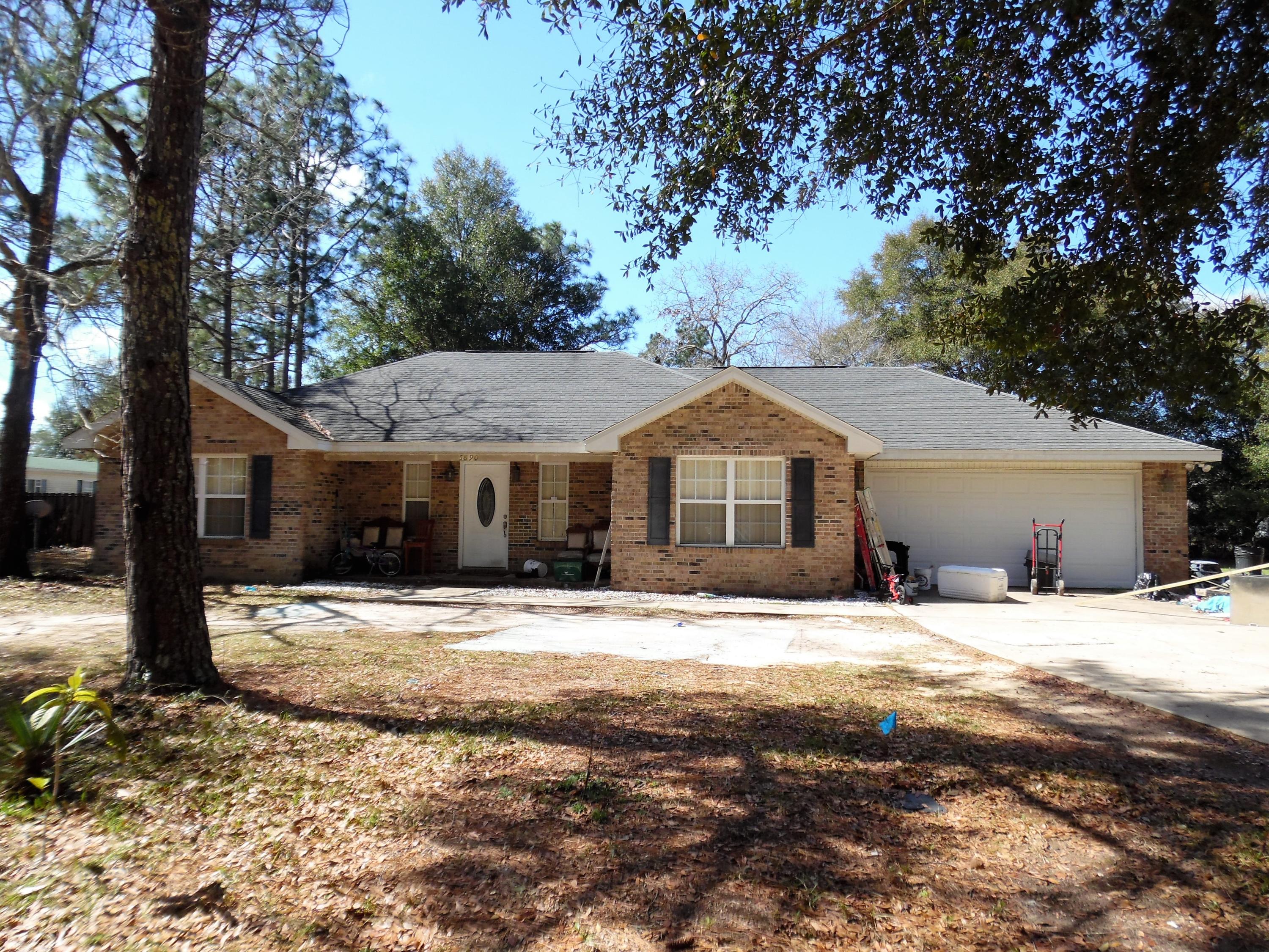 If you want to get out of the hustle and bustle and still be convenient to shopping and city, this is the perfect spot. This is a quality built, brick home on an over-sized lot with plenty of room to park an RV or boat. The extra large, privacy fenced back yard has a hot tub right out the back door. Inside, enjoy some privacy with the split floor plan, large walk-in closet in the master bedroom and private bath. The master bedroom features a double trayed ceiling. Located on 1/2 acre not far from town. No carpets here! All floors are tile and laminate wood! This home features the popular open floor plan. The living/dining area is very spacious and has a high vaulted ceiling. There is a large laundry room and over-sized garage. See more.... The appliances will include a built in microwave, self cleaning oven, dishwasher and a newer double sided stainless steel refrigerator with ice maker. The front porch is just right for a set of relaxing rocking chairs! Hot tub to convey as is.