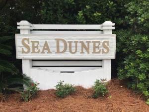 Fantastic Opportunity and lowest priced lot offered for sale in Sea Dunes. Build your ''Beach Dream''. The lot is .7 miles from the beach access at the end of Allen Loop. Jump in your cart or on your bike and in minutes you are are the sugary white sands. You are in close proximity to shopping and dining in Gulf Place as well as close to schools and hospital. Sea Dunes is a quaint, quiet, established neighborhood with no build out time. Sea Dunes does not allow short term rentals.