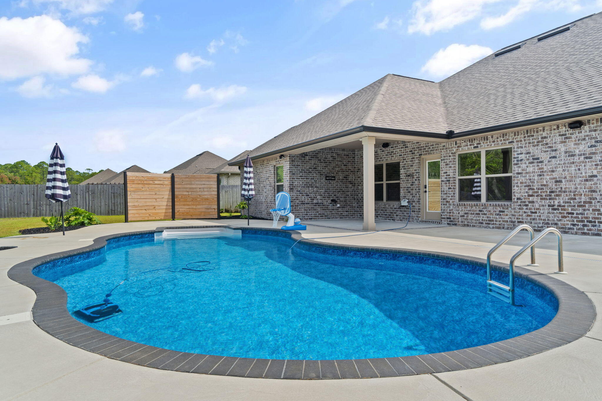 One of the most remarkable homes on the market in Natures Cove! If you have been waiting for a luxurious ''newer construction'' pool home, then this is it!! 
This Breland custom built home broke ground in 2020 and it still looks and feels brand new. The community, Natures Cove is desirable due to its location, underground utilities, sidewalks, LED lights and gorgeous landscaped yards! Some of lots, like this one, have more private yards than others. Areca Palm features a fully fenced yard, new pool with a new wireless auto filler, natural gas to the home, and a tankless water heater for those endless hot showers! 
The master bathroom has recently been remodeled like no other home in there! The new tiled shower and deep soaker tub with black hardware are eye catching! CLICK MORE... The hardware and lighting has also been updated after the construction was complete, just to give the home a one of a kind look. The stainless steel appliances will convey with the purchase as well. It's move in ready for the next family to fall in love, so make your private showing appointment asap, because Natures Cove pool homes don't last long!!