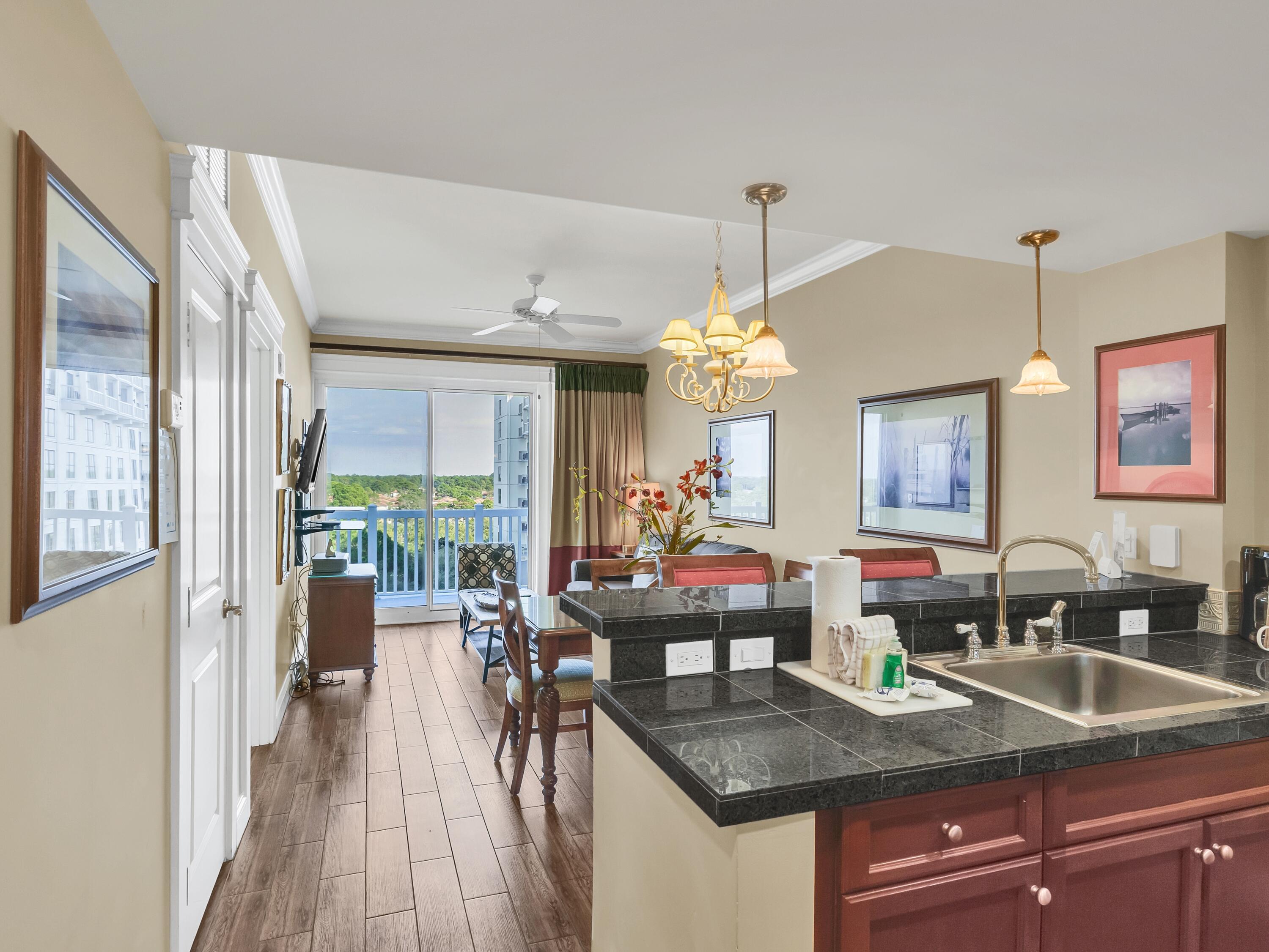 FULLY FURNISHED 1 BEDROOM WITH UTILITIES INCLUDED! This condo offers beautiful views of the bay and golf course from the 7th floor. Enjoy sipping your favorite beverage while sitting outside on the balcony taking in the serene views. Wood look tile flooring extends throughout the condo, ideal for sandy beach living and easy maintenance. The fully equipped kitchen features stainless steel appliances with a smooth top range. The Grand Sandestin offers a community pool, hot tub, on-site fitness center, and is just a short stroll away from The Village of Baytowne Wharf with great dining, shopping, and fun entertainment options. Come relax and enjoy the resort lifestyle!