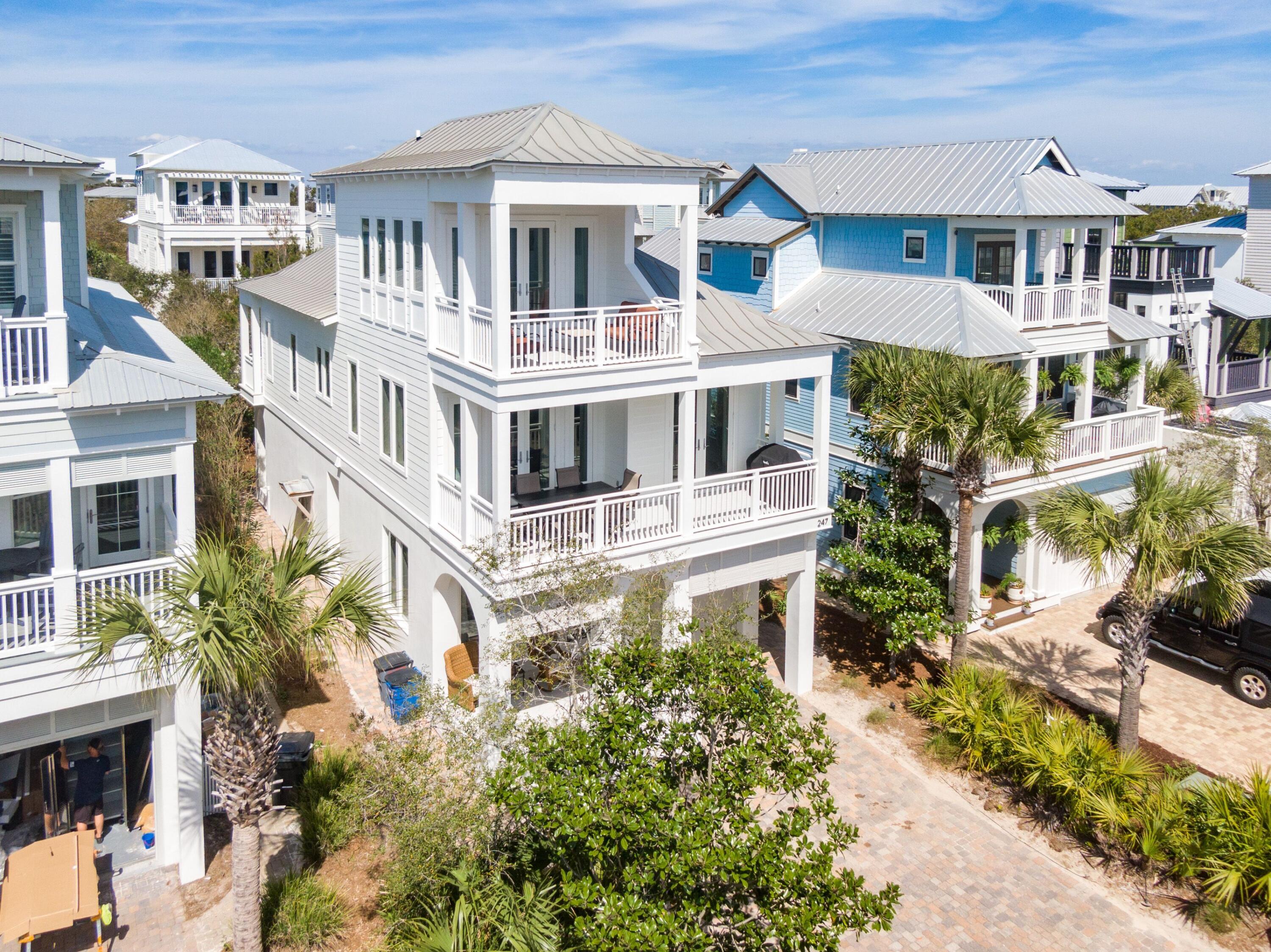 Located 30 seconds from the private beach and pool for Barbery Coast owners & guests only, 247 Winston Lane is on the west end of Inlet Beach, as close as you can possibly be to Rosemary. Featuring massive gulf views, the top-floor suite is a private, luxurious experience, constantly reminding you of why these waters capture the heart of so many. The property holds rare amenities for a beach home such as a single car garage, a well-stocked kitchen equipped with a gas range and wine cooler, as well as plenty of parking out front. 

The open second floor gathering space is designed exquisitely. The lengthy balconies are perfect for letting in the salt air with the gas grill and dining area right off the kitchen perfect for the family's most cherished holidays. Upon crossing the threshold you will appreciate the luxurious beach vibes this home provides. With hardwood floors throughout and tasteful designer touches, this home is sure to give you the relaxing quality time you deserve. On the first floor, you will find two guest bedrooms, and a living area sure to please the kids and a shared bathroom with a walk-in shower and laundry. The first guest bedroom features a king-size bed, an en suite with a tub/shower combination and private access to the backyard. Right next door is the bunk room, supplied with a twin over twin bunk bed and a queen-size bed.  

Making your way to the second floor, you will obtain peace in the open concept main living area, equipped with everything needed for a modern-day vacation. Cook a home-cooked meal in the kitchen with pleasure, featuring a gas range and wine cooler; then savor that gourmet meal to the dining table with seating for eight. Watch the sun go down from the second-floor balcony while sipping your favorite cocktail, then bring the party to the living area and watch a movie on the large flat-screen TV next to the toasty fireplace. Cozy up in the master suite, also located on the second floor, furnished with a king-size bed and pamper yourself in the en suite featuring a large walk-in shower, over-sized soaking tub, and dual vanity.

Situated on the third floor, the second master suite, complete with a second king-size bed, private en suite, and private balcony to bask in the waters.