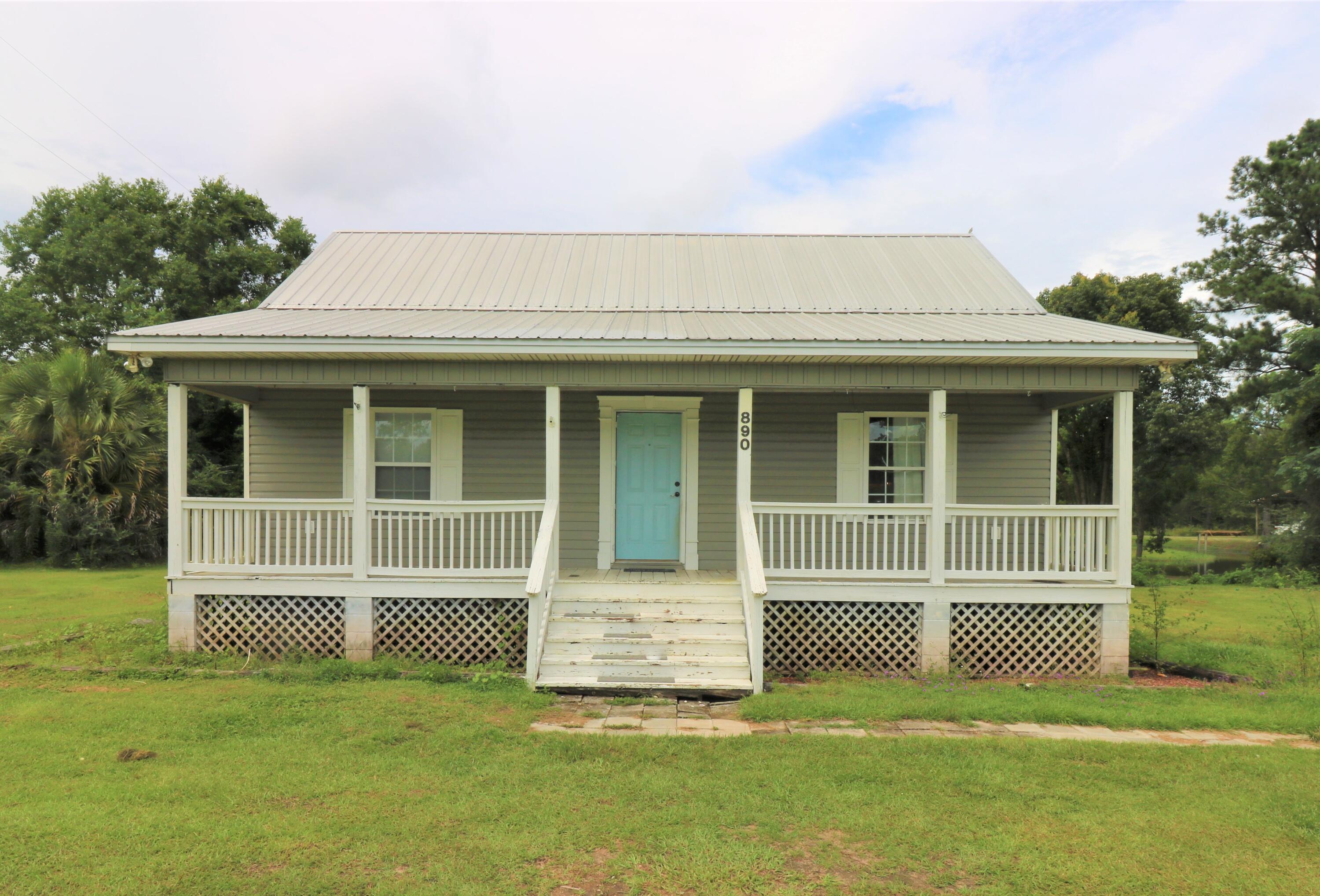 This 2007 built home is waiting for you with open arms and beautiful features. It will impress you with modern hardwood flooring, crown molding throughout, custom cabinets, kitchen breakfast bar, and solid surface countertops. Bonus features include new refrigerator, the vaulted ceilings in living room and kitchen, and master bath garden tub and separate shower. Bring your rocking chairs and enjoy peaceful quiet time on the front porch that spans the length of the home. Grill it up in the back yard on your concrete patio. This home is in a great location...shopping, medical facilities, and I-10 access. It is within 45 miles to The World's Most Beautiful Beach of Panama City Beach and approximately 45 miles to NW FL Beaches International Airport