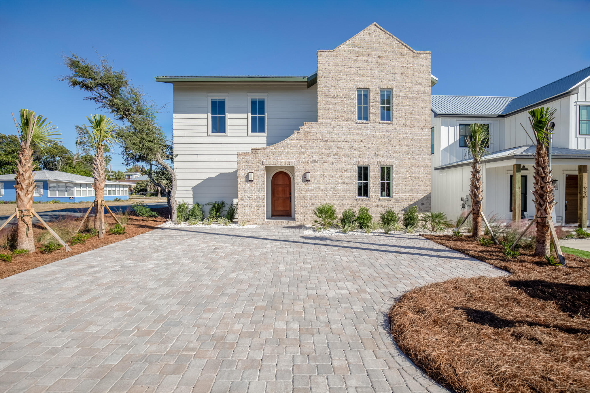 This modern 4-bedroom, 3.5-bathroom home offers just over 2,000 square feet of stylish living space. Located just a 5-minute walk from the beach, this property features a private heated pool, turf backyard and a grill area perfect for outdoor entertaining. Built in 2024, this newer build is a turn-key vacation rental.