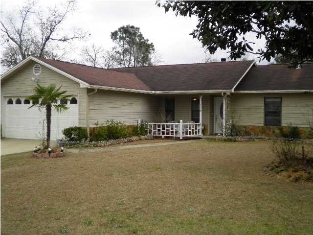 South of I-10! Call today to see this 3BR/2BA home w/ two car garage, on a level lot, fenced, screened porch on back, open living room, kitchen and dining, split bedroom plan and more. Owner will consider pet on case by case basis.