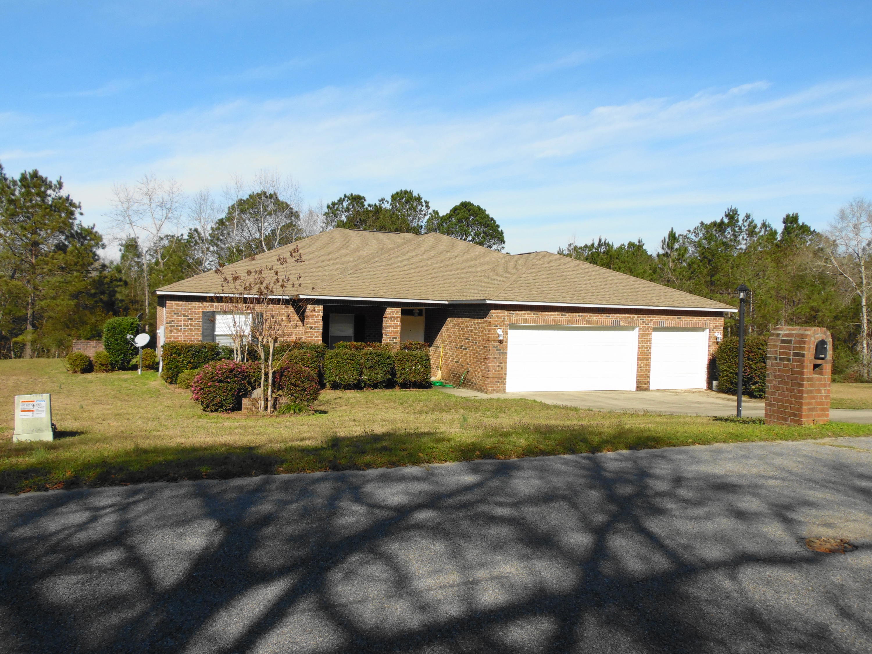 Beautiful quality built 1 story brick home with a 4 bedroom and 3 bathroom split floor plan. There is 2504 sq ft of livable heated/cooled space that includes an added exercise room, approximately 800 sq ft of usable garage space with a utility sink, and a 288 sq ft covered porch. There is also extra storage/attic space above the garage. Master bedroom has a double vanity, jetted garden tub, and separate shower and toilet room. The great room/open floor plan has tons of flexible living and storage space. New 4 Ton, 15 SEER heat pump installed in 2015, and new microwave. Out back is a newly built metal workshop with cement floors, OSB interior walls, 110/220 power, LED shop lights, and outside water bib. A lot of living and storage for $269,900. Close proximity to I-10 and shopping and most of all the beautiful white beaches of south Walton County. Easy commute to Niceville and Eglin AFB.