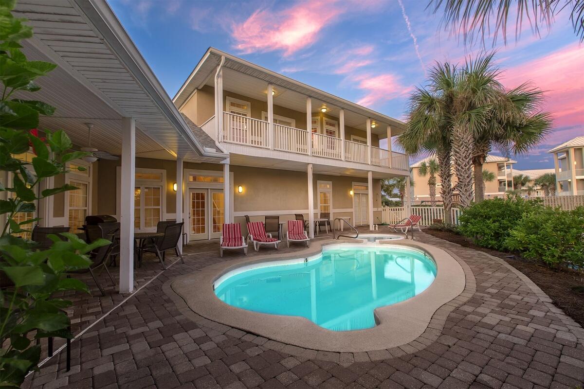 196 Avalon Blvd in Miramar Beach offers the rare combination of location, layout, and opportunity. Located in the gated community of Avalon Beach Estates, a Gulf-front community with deeded beach access, this fully furnished beach home is just a short stroll to the sugar-white sands and offers gentle Gulf views from the upper level.

Designed for gathering and multi-generational living, the thoughtful floor plan features the owner's suite plus two additional bedrooms connected by a shared bath on the first floor, creating ideal separation and convenience for guests. Upstairs, a private second suite is paired with a loft-style flex space, kitchenette, and balcony with Gulf views, offering excellent potential for guest privacy, entertaining, or enhanced rental appeal.

Expansive living areas are filled with natural light from transom windows and enhanced by soaring 10-foot ceilings, creating an airy coastal feel throughout. The open-concept design flows seamlessly to the private pool and outdoor entertaining space, while four true bedrooms provide flexibility for full-time living, a second home, or vacation rental investment.

With generous square footage and short-term rental approval, this property presents an exceptional opportunity for a buyer ready to update and personalize in one of Miramar Beach's most desirable locations. Enjoy low HOA fees, community tennis and pool, and close proximity to Sandestin Golf and Beach Resort. bath access and ground-floor pool access.

Upstairs, discover the owner's retreat: a master suite with king bed and private bath, paired with a cozy den featuring a wet bar, seating for two, and a separate balcony with gulf-peeking views. Outside, a private pool and patio beckon, and the community's large lagoon-style pool, tennis courts, and gated beach access are just a short stroll away.

Located in the exclusive Avalon Beach Estates community in Miramar Beach, this home blends privacy with the vibrant lifestyle of Destin's Emerald Coast  minutes from beachfront dining, shopping at the nearby outlet and mall, and the best seafood restaurants and nightlife on Scenic Gulf Drive.

Fully furnished and turnkey, 196 Avalon Blvd offers a rare opportunity to own not just a vacation home, but a lifestyle where morning coffees and salty breezes, barefoot walks to the beach, and poolside sunsets feel effortless.

Exterior and interior painting and repairs being completed by end of January.