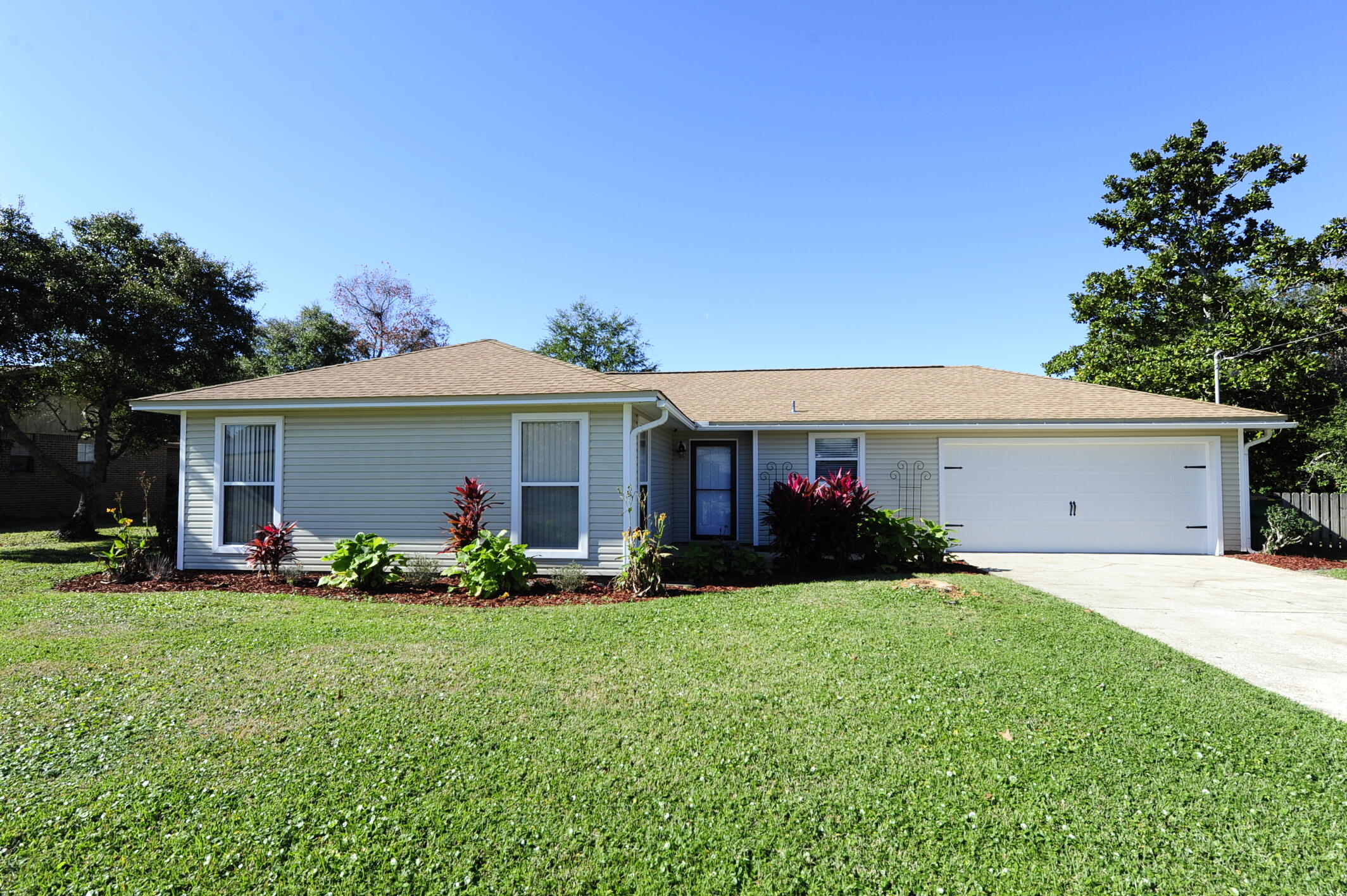 Located in the heart of Destin, close to the Destin Harbor, beach, restaurants, shopping, and schools, this house is move in ready. It has a new roof with impact glass skylights, new chimney cap and stack cleaned, new garage door and opener, new cabinets with soft close doors & drawers and granite in kitchen, new shower in primary bedroom, new ceiling fans, fresh interior paint and flooring in living/great room, recent HVAC and new termite bond.
Large back yard for a pool, or an addition, and no restrictions for storing your boat or RV in the driveway.  *Agent has equitable interest in the property.