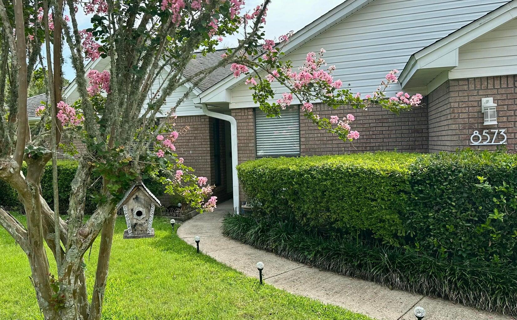 Welcome to this beautifully renovated 3-bedroom, 2-bathroom single-family home located in the quiet, family-oriented neighborhood of Belle Meadows. Designed with modern living in mind, this home features an open-concept layout that seamlessly blends comfort, style, and functionality. The heart of the home is the stunning modern kitchen, complete with soft-close cabinetry, sleek quartz countertops, subway tile backsplash, modern cypress shelving and a spacious walk-in pantry. Enjoy cooking with a full suite of stainless steel appliances, including a stove, dishwasher, microwave, and refrigerator. While the home is electric, gas is available in the community. The vaulted ceiling in the family room enhances the bright, airy feel of the space, complemented by a custom shiplap accent wall and a cozy electric fireplace. Fresh interior paint throughout adds a crisp, updated touch, while the open dining area creates the perfect space for hosting family meals or entertaining guests.
Retreat to the remodeled primary suite, which boasts a double vanity, tiled shower and large soaking tub ideal for relaxation. The secondary bathroom also features thoughtful upgrades, including a new vanity and shiplap walls for a clean, modern aesthetic. Both guest bedrooms have built in desks and book cases!
Step into the spacious Florida sunroomcomplete with heat and airthat overlooks a fully fenced backyard perfect for play and privacy. A mature pear tree, custom stamped concrete patio, and ample space for gatherings make this backyard an entertainer's dream. The current owner had plans for a custom pool oasis, and those plans are available for your reviewimagine the possibilities!
Additional highlights include a 2-car garage with a work bench, ideal for hobbies or extra storage. The location offers easy access to I-10, as well as nearby shopping, dining, and top-rated schools, making everyday living both convenient and enjoyable.
Don't miss your chance to own this turn-key beauty in one of the most desirable neighborhoodsschedule your private tour today! NEW WATER HEATER, ROOF is 7 YEARS OLD, SELLER WILL INCLUDE A FREE 1 YR HOME WARRANTY!
