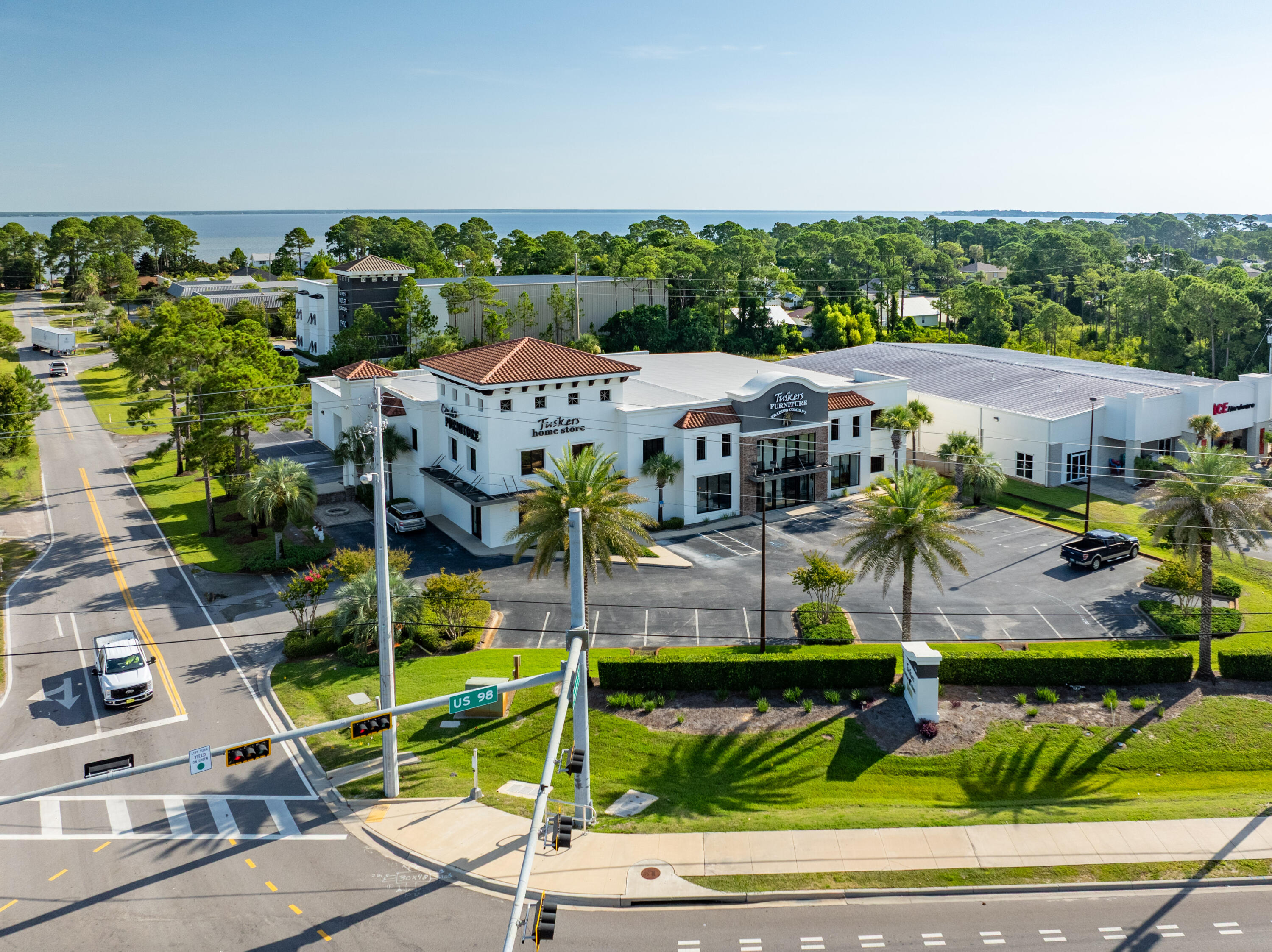Extraordinary freestanding retail building oriented on a prime corner parcel at a signalized intersection in proximity to the synergistic retail nucleus of Silver Sands Premium Outlets in South Walton County, Florida, and centralized to all the local mixed-use districts, successfully catering to retail patrons from all local peripheral sub-markets, including but not limited to Destin and Scenic 30A of Santa Rosa Beach, Florida.  Fronting Highway 98 in Miramar Beach, Florida, ±50,000 vehicles pass by its 196 fronting feet daily, which convenient ingress and egress lures the traffic into the retail facility through the traffic light at North Geronimo Street and Highway 98 in Miramar Beach, Florida.  The current owner has committed significant capital by renovating the building, which even includes escalators to service the second floor of the main showroom.  The parcel contains a two-story building, oriented on approximately 1.18 acres, hosting prime retail and showroom space, as well as private offices, collectively measuring approximately 26,893 conditioned square feet. There is a 3rd floor that accommodates a spectacular executive office, accessible via a private "floating" staircase. The structural integrity of the building is phenomenal, and the finishes throughout are exceptional. This opportunity is irreplaceable, as Walton County land development code would neither accommodate this expansive yield, nor would a developer endeavor upon such a project, as the development and building costs indicative of this era, coupled with land costs, (even if such prime vacant commercial land at a traffic light were available, which is nearly non-existent), would likely exceed $15m+. The current business is winding down its operation, and thus, occupancy should be plausible by ±March, 2026.  All showings are by appointment only and require advanced notice. The listing broker(s) must accompany all showings.