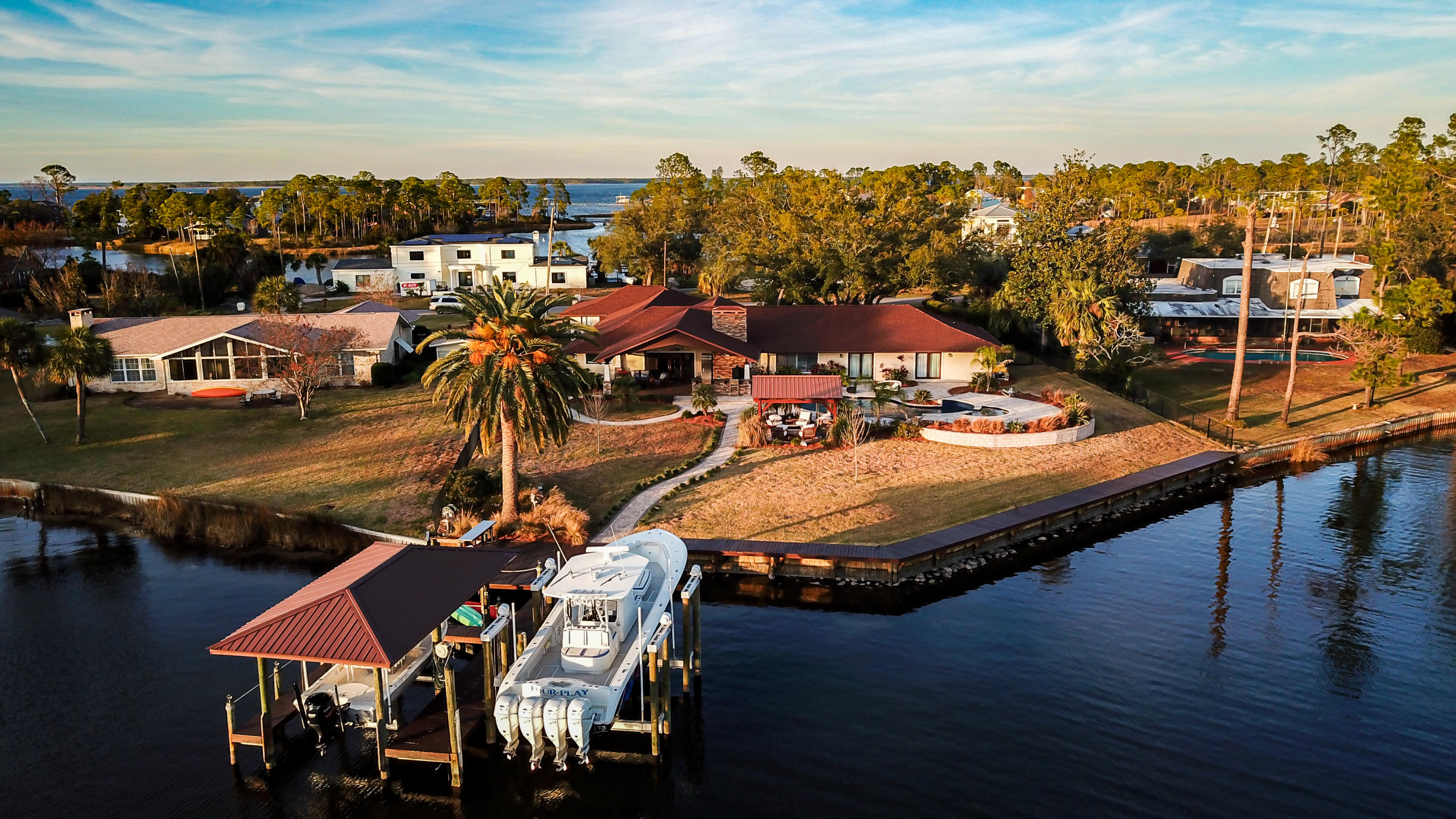 Stunning One-Story Home with 3 Car Garage In The Desirable Neighborhood Kings Point. The 4 Bedroom 3.5 Bath Home is 4,152 sqft  on a 0.79 Acre Lot with 156ft of Waterfront. BRAND NEW ROOF! NO HOA! The Home Is Completely Upgraded Offering Open Concept Living Spaces With The Kitchen, Living Area, and Master Suite all being Waterfront with Great Views of The Bay. This Property Is a Boaters Dream. The Home Offers a Chefs Kitchen with Top of The Line Wolf + Subzero Appliances. Gas Stove and Fireplace. Granite Countertops Throughout The Entire Home. Huge Home Office. 2 Laundry Rooms. Outside is a Summers Kitchen. Pool and Waterfall Hot-tub. Relaxing Waterfront Gazebo w/ Fire-pit. Top of The Line Boat Dock with Two Boat Lifts and a Jet-ski Floating Dock. 500 Gallon Fuel Tank and Ice Machine.