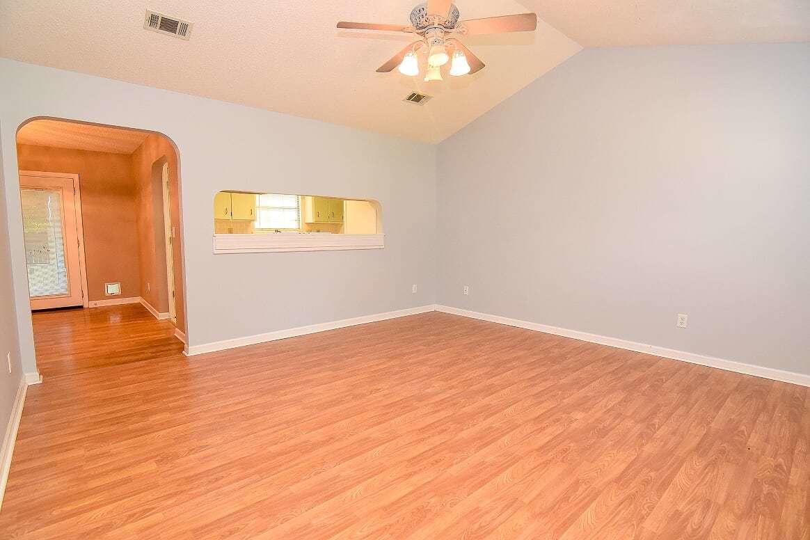 What a great house at a great price! On a quiet cul du sac,this home has so many wonderful features. While the square footage looks small, the home feels much larger and the vaulted ceilings in the living room and master bedroom contribute to that. Most rooms have been freshly painted and have new flooring. The bathrooms have just been redone and the master bath is absolutely luxurious! You won't find that in any other home at this price! The kitchen has a cute retro feel but could easily be painted should your buyer prefer. The screened porch is large and perfect for kids and pets,complete with doggy door and a concrete floor! The large fenced yard with outdoor shed has lots of room and the big garage features built in storage. Metal roof & great location. Must see it for yourselves!