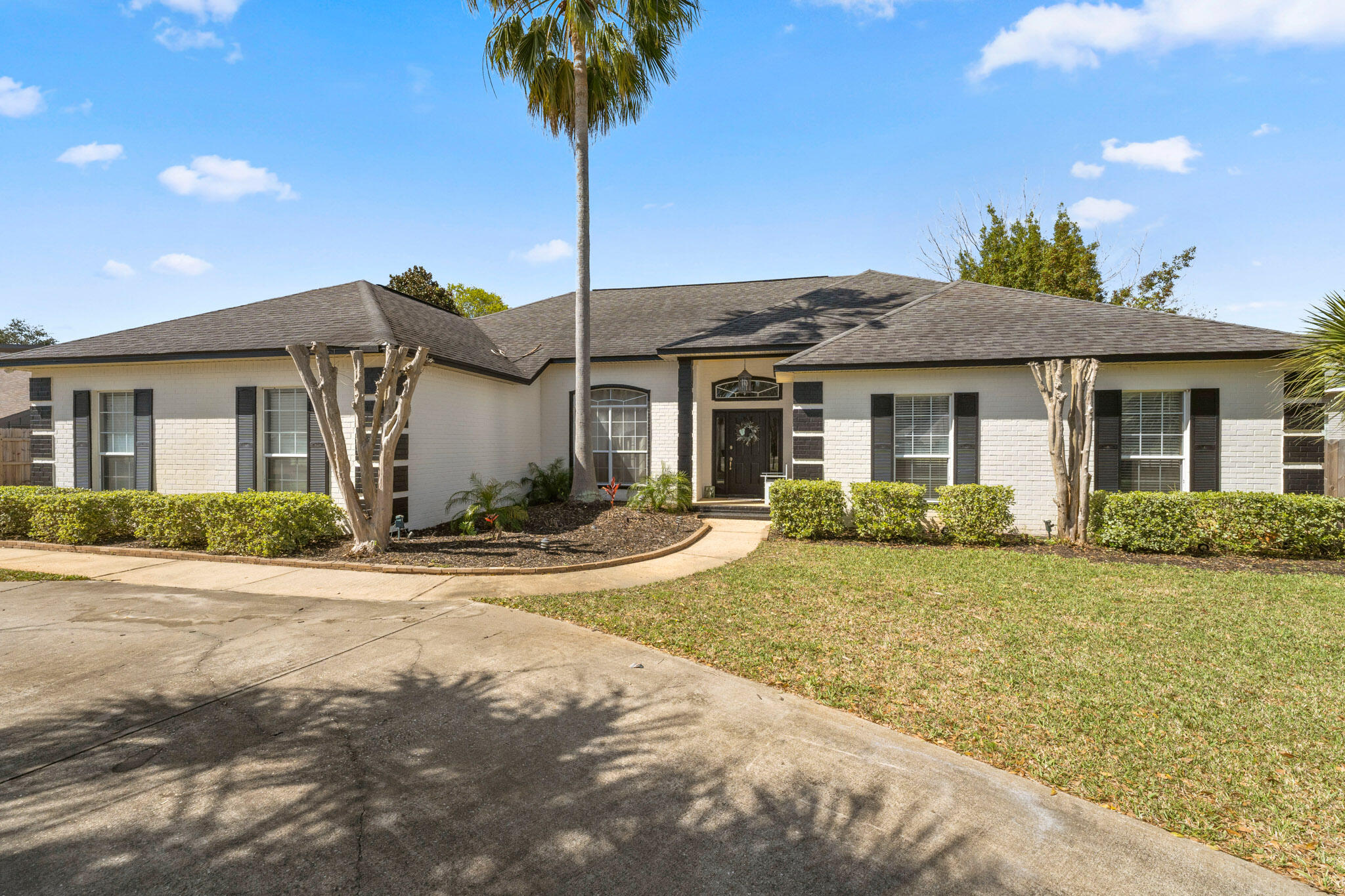 Beautifully designed Indian Bayou home featuring a circular driveway, a two-car garage, and a private enclosed pool. This split-floor plan accommodates a wide variety of homebuyers with spacious layouts and designated area use. Several updates have been done throughout the entirety of the home including new LVP flooring with a 4-year warranty, new 2022 Refrigerator, and recently renovated bathrooms. Upon entering, the foyer will lead into the open layout of the living room, dining room and kitchen area - each of which is perfect for hosting family and friends. Directly off the living room is a large sunroom that overlooks the outside patio area and pool. The outdoor area is perfect for entertaining as a paradise retreat for swimming, grilling, and a glass of wine while relaxing.  The main gate is an 8' tall fence that provides complete privacy from surrounding neighbors for warm summer pool days and late-night bonfires using your very own firepit. The eat-in kitchen boasts stainless steel appliances, wine refrigerator and bar area, wood countertops along the breakfast bar and an extensive amount of cabinets for storage. There are three full bathrooms with luxurious finishings! The master ensuite includes an extra-large walk-in shower with double vanities and a walk-in closet. This home does come with a security system and a security TV located in the master suite for the safety of your family. For further updates and inclusions, check the documents section