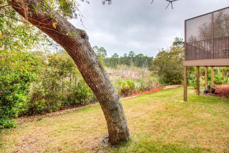 3 bedroom home with a large deck overlooking estuary. Open floor plan with gas fireplace. Also has separate Florida room. Master bedroom on first floor with its own fireplace and large beautiful bathroom . plus an over size garage. lots of storage great neighborhood