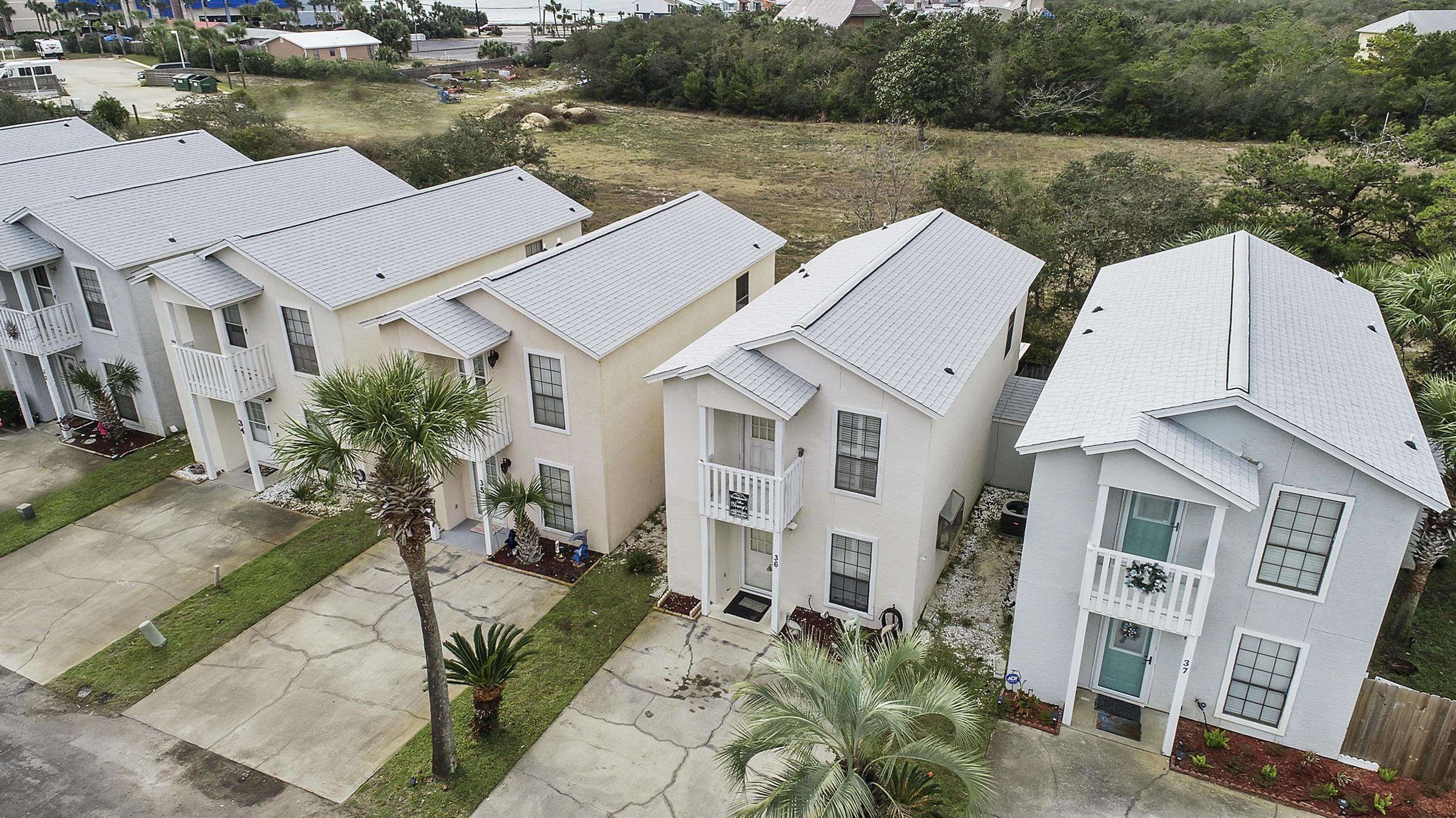 Affordable 2 Bedroom 2½ Bath Just a Short Walk Across the street to the White Sandy Beaches and Emerald Water of the Gulf of Mexico. This is listed as a Condo but is a detached unit. The unit Features a large kitchen with Plenty of Cabinet & Counter Space, Washer & Dryer, Dinning Area, Fenced in Back Porch and Outside deck off the front Bedroom. This Small Complex includes 2 Pools, a Club House & Low Homeowners Fee. Located on the Popular West end of the Beach. Close to Pier Park, Shopping & Dinning. These units do not come on the Market Often. Call your agent today to schedule a visit. All ages, measurements and room sizes approximate. Please verify if important.