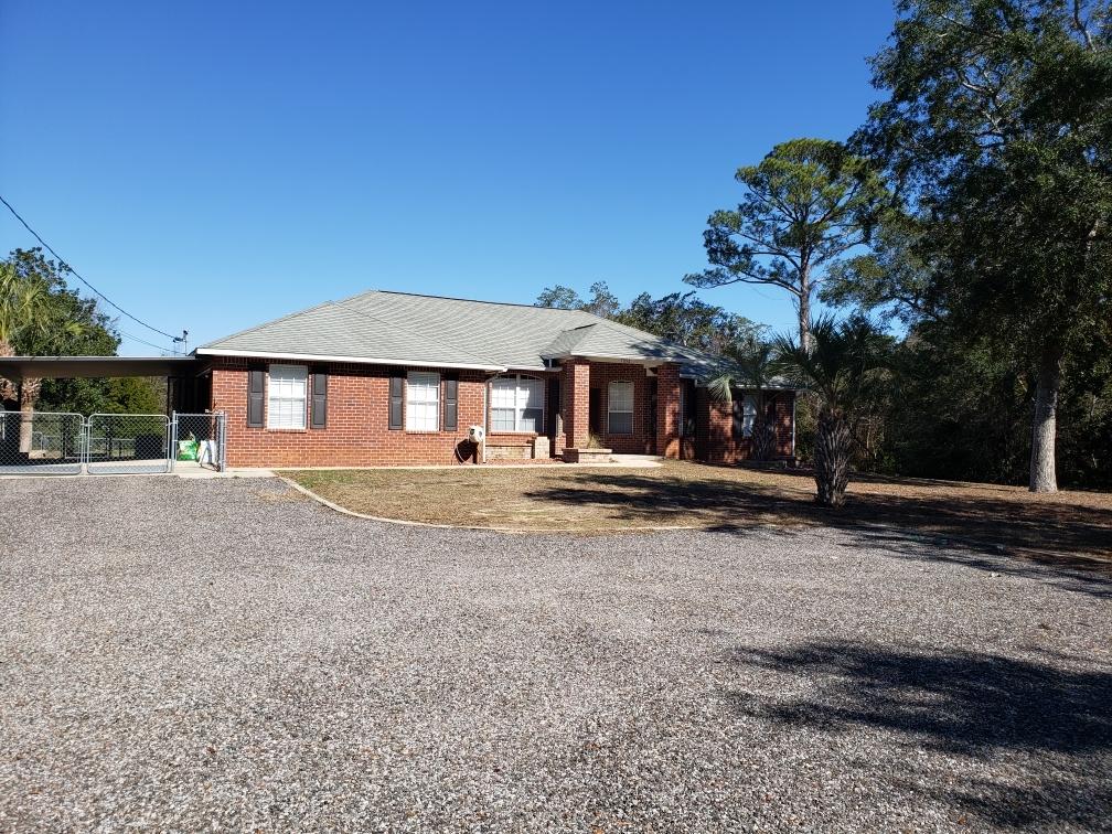 Large brick home and LOTS of parking. Garage cannot be used to park vehicles but there is plenty of other parking available. Large, fenced yard with a beautiful deck. Granite counter tops ,cherry cabinets and stainless appliances in the kitchen. Fireplace in the living room. Laminate flooring throughout the home except tiled areas, no carpet! A pet may be considered with owner approval and payment of a non-refundable pet fee. No smoking inside home or garage.