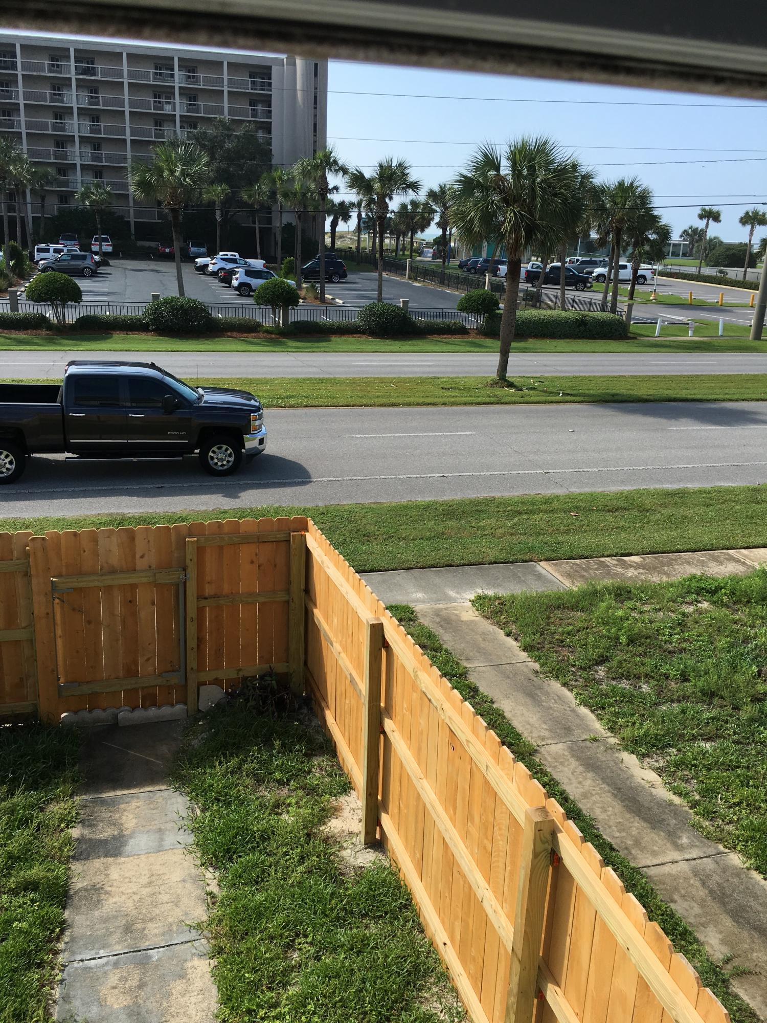 LOCATION! Remodeled November 2017, 2 bedroom 1.5 bath townhome across the street from the Beach on Okaloosa Island. 2nd level features 2 bedrooms, 1 full bath and dressing area with double vanity, bath/shower, carpet, bathroom cabinets and counter tops all replaced 2017. 1st level features Laundry, Kitchen with new counter tops, Side by Side refrigerator, microwave, stove and dishwasher. Spacious living room features wood burning fireplace and half bath. Small storage room off the patio and 2 parking spaces. The beachside entrance has a privacy fence which is about 600 yards to the public beach access. No pets Owner is a licensed Florida Realtor. Security deposit $1350