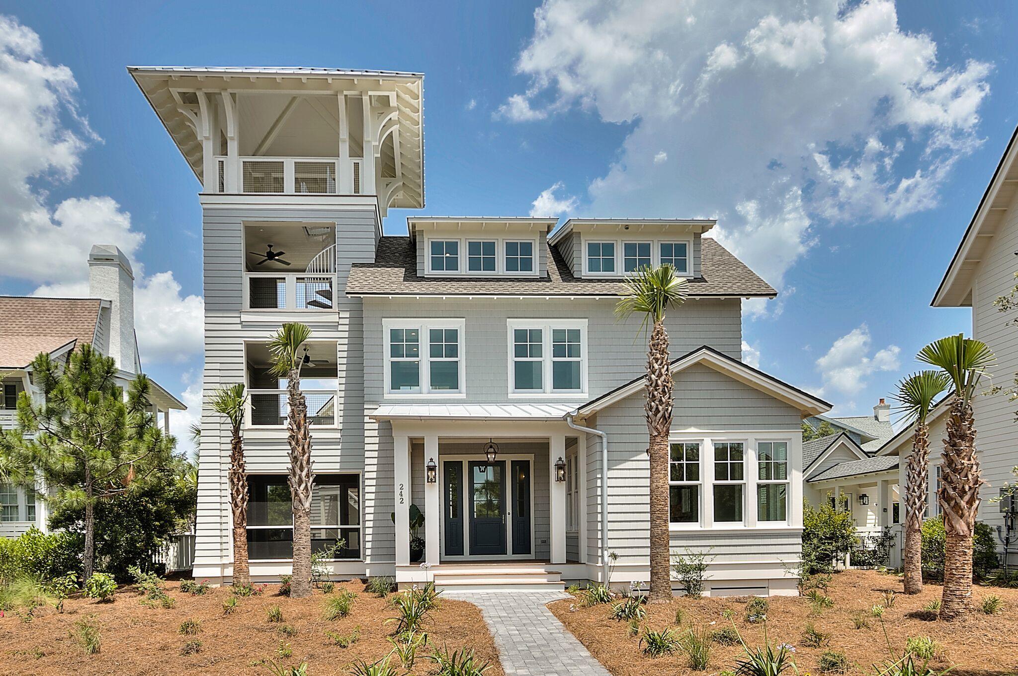 This brand new 5 bedroom beach house including a bonus bunk room and appointed carriage house is located in WaterSound Peninsula and tucked away South of Scenic 30-A on Gulf Bridge Lane. Offering breathtaking Gulf and lake views as far as the eye can see from the fourth floor viewing tower, this home offers coveted first and second floor masters and access to outdoor living off of each of the bedrooms. The backyard oasis features an infinity hot tub, L-shaped pool and outdoor kitchen equipped with a grill, ice maker and mini fridge. The spacious covered front porch greets you as you enter the home's open concept great room with soaring ceilings and beautiful wire brushed oak floors throughout. The large living room offers concrete geometric wall tile that spurs the conversation, recessed lighting, a double sided fireplace and two doors opening to the screened in porch. The coastal kitchen catches your eye with white cabinets, a Thermador gas stove and custom range hood accented by a beautiful tile backsplash, a Thermador wine fridge and custom Thermador refrigerator that blends perfectly into the space. The heart of the home is centered around a large custom-finished kitchen island with an apron sink, stunning pendant lights, Thermador dishwasher, and breakfast bar seating. The custom pantry is located just off of the kitchen and offers much desired additional storage space. Also located off of the kitchen is the dining room finished in shiplap with soaring ceilings, scissor trusses and an oyster shell accented chandelier. With picture windows throughout, the first level of the home is flooded with natural light and offers a conveniently located half bath that leads to a spacious laundry room. The main floor master ensuite offers a walk-in closet featuring built-ins and direct access to the pool deck. The second level of the home offers the primary master bedroom finished in shiplap with a private covered balcony and a master bath featuring a soaking tub, glass shower, double vanities and pocket door. On this level is an additional laundry and guest bedroom ensuite accented in wainscoting and also featuring a private covered balcony. The third level of the home offers a bonus bunk room with dedicated living space and equipped with built ins, a linen closet and an attached full bath. Unfinished attic space is also located on this level for additional storage options. Off of the bunk room is a covered porch with a spiral staircase leading to the fourth floor tower that offers panoramic views of WaterSound and forever Gulf views. The main level's screened in porch opens to the outdoor kitchen and pool deck and features a shared fireplace to warm up the coolest evenings spent making memories here. The appointed carriage house is located off of the fenced in pool deck and offers a spacious living room, large bedroom and full bath with 13-foot ceilings and transom windows throughout for that added Southern charm. The carriage house is perfectly placed above a 2-car garage complete with epoxy floors. This WaterSound beach house built by Watercrest Homes is a must see! Call today to schedule your showing.