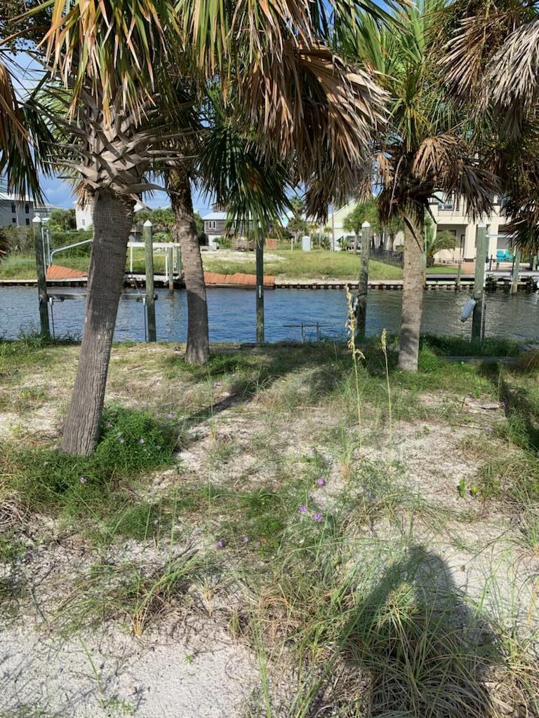 Incredible canal front lot with access to the Santa Rosa Sound and NO HOA! Imagine the dream home you could build-the possibilities are endless. There are very few building lots left on Navarre Beach. This deep water canal front lot is partially cleared and ready for your new home.