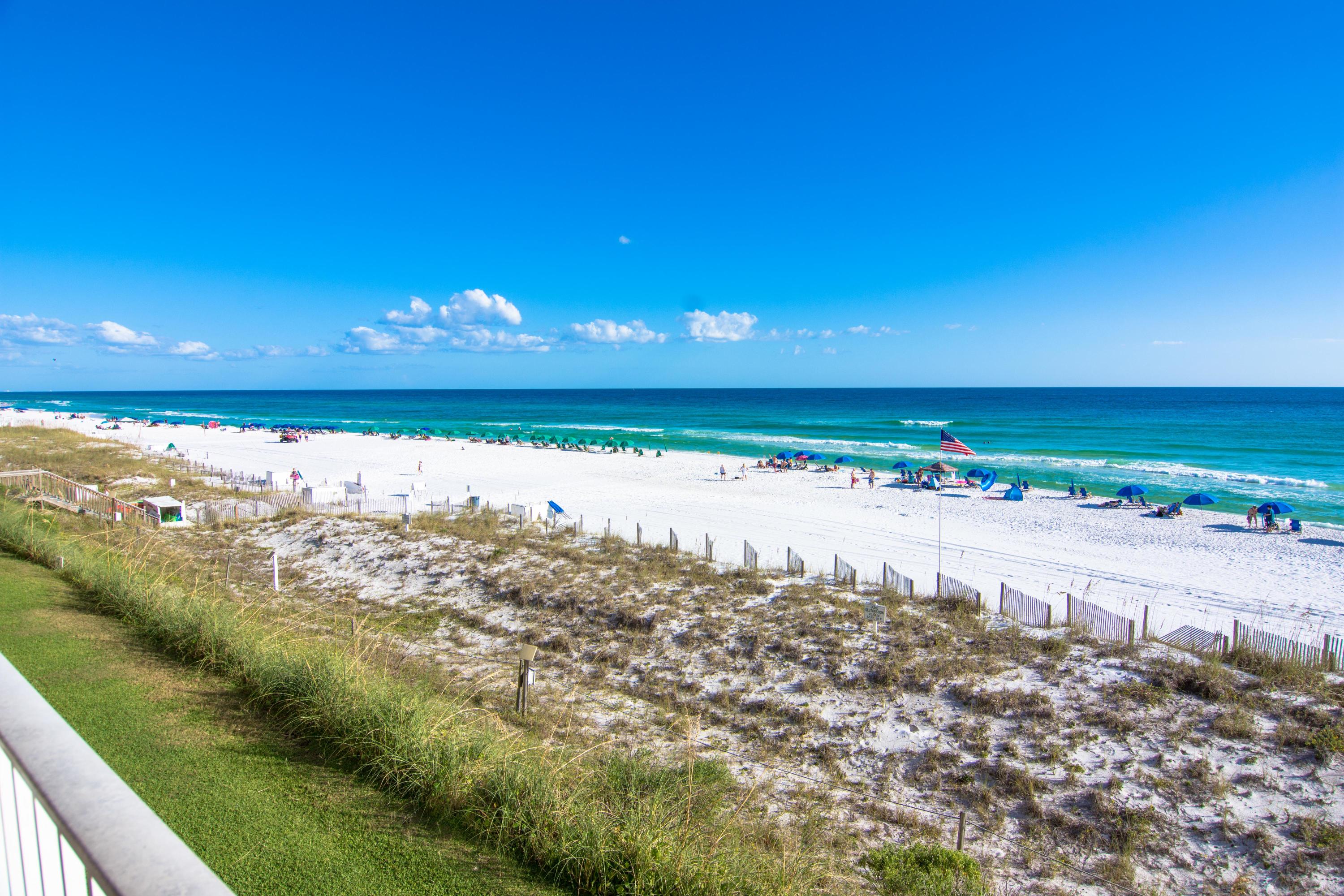 $70-80K consistent rental income! Luxe renovated condominium directly on the beautiful Gulf of Mexico beaches but nestled in tony Crystal Beach. No detail has been overlooked decorating and upgrading this stunning condo with the coastal style everyone loves! Enjoy a Gulf front master suite with renovated bathroom featuring tile plank floors, custom cabinetry and a huge walk-in shower with dual heads; a king sized guest suite with attached renovated bathroom plus a large bunk room with closet. The gourmet kitchen features gorgeous slab granite counters and wood cabinetry plus sleek stainless fridge and stove. The beautifully appointed living room opens to the large balcony with unparalleled views overlooking the beach and the Gulf.
This condo is a rental powerhouse! Enjoy the resort style amenities of Crystal Dunes including: gated entrance,  on-site rental office, seasonally heated swimming pool, bbq grills and picnic area and beach walkover and beach showers.