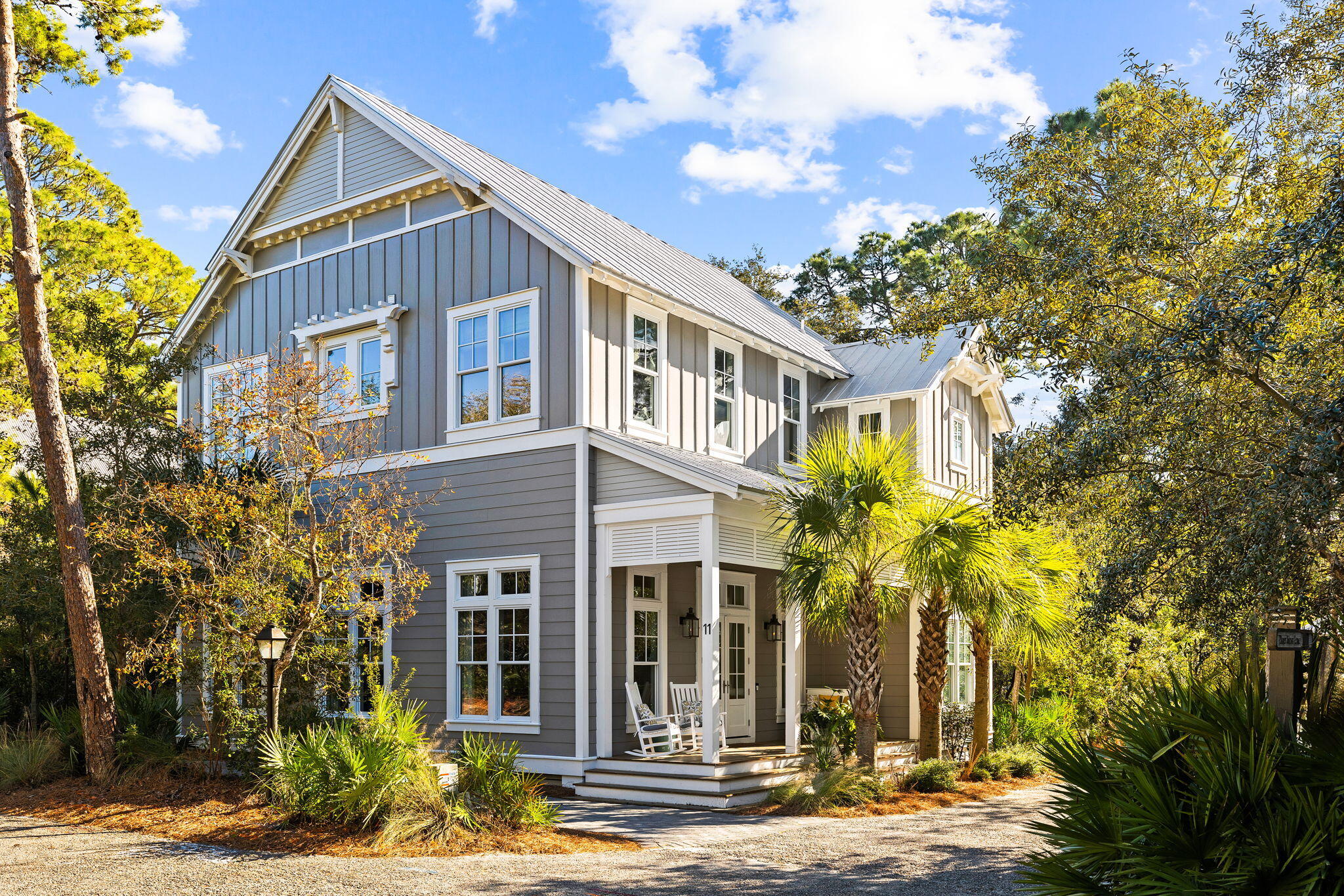 Tucked away in the exclusive Hammocks of Seagrove gated community, this exquisite 4-bedroom, 4.5-bathroom home is a masterpiece of coastal elegance, perfectly positioned for the ultimate 30A lifestyle. From the charming front porch with its welcoming swing to the convenient golf cart garage and additional storage for all your beach and biking needs, every aspect of this home has been thoughtfully designed for comfort and convenience. A mere half-mile from the nearest public beach access, this residence, offered fully furnished, promises the perfect balance between secluded retreat and beachside living.

Step inside to discover an expansive open concept living area, where warmth and natural light are amplified by soaring 12-foot ceilings on the first floor. The kitchen itself is a highlight, boasting a central island with an integrated sink, complemented by open shelving, stylish tile backsplash, a high-end gas range, wine refrigerator, and ice maker for the ultimate in culinary convenience.

Comfort is paramount, with a master suite located on each level, featuring double vanities in every bathroom to provide a spa-like experience for homeowners and guests alike. The residence's architectural excellence continues on the second floor, where 10-foot ceilings create an airy, elevated ambiance throughout the bedrooms and upstairs living. This meticulous attention to detail ensures every corner of the home feels open and inviting, contributing to the overall serenity and charm of this coastal cottage. This home includes a specially designed bunk room and a cozy living nook upstairs, perfect for additional guests or a quiet reading space. Outdoor living highlights include a screened porch off the kitchen for serene mornings and an outdoor sitting area for nights under the stars. There is an additional porch upstairs, offering a private outdoor retreat off the upstairs master and living area. 

Residents of this community enjoy access to two community pools, adding to the allure of this exceptional property. With its blend of luxury, convenience, and coastal charm, this home offers a lovely retreat in a prime location near Seaside, WaterColor and all the restaurants and shopping of central 30A.