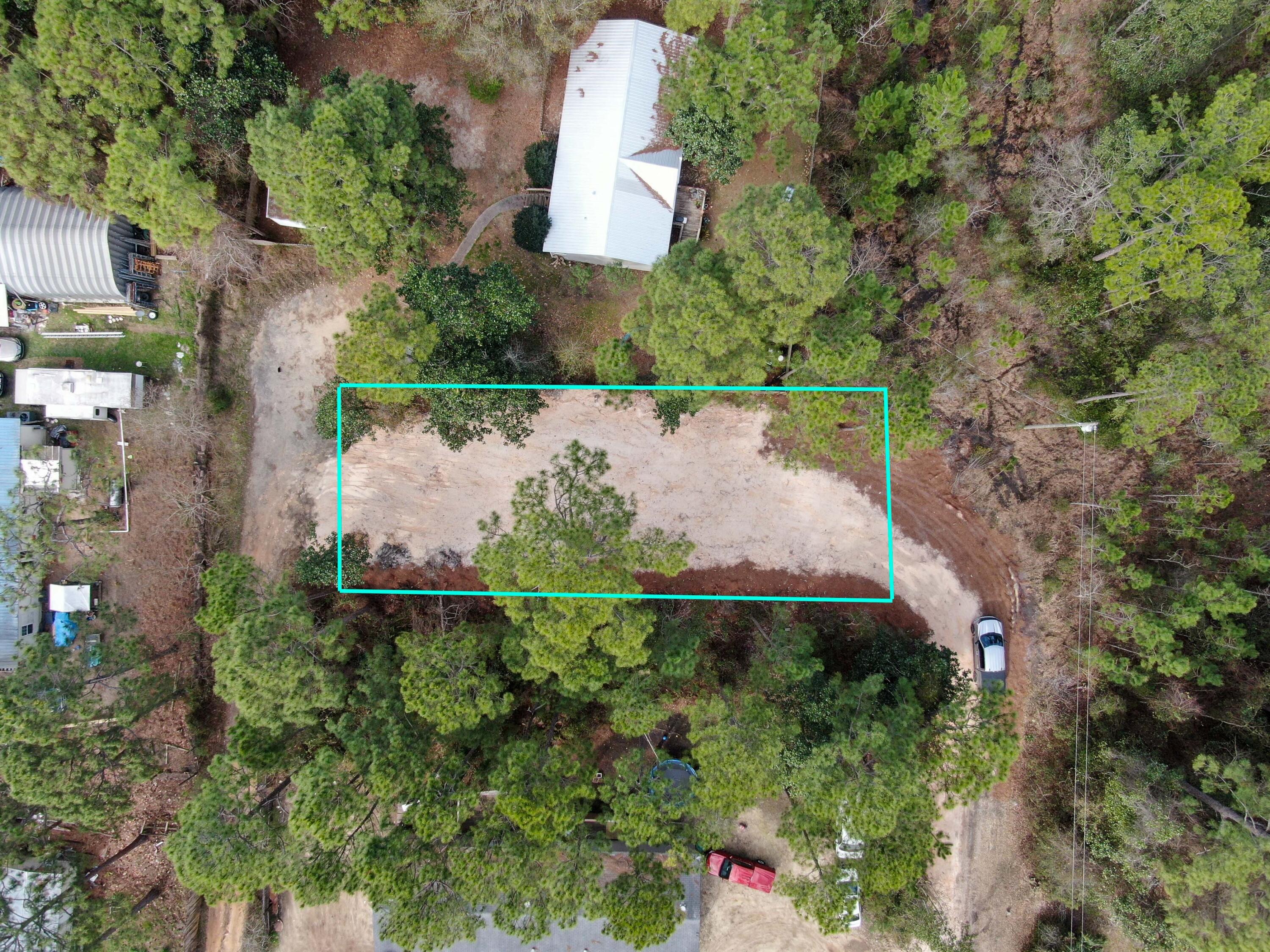 This lot is ready for a tiny home. The seller has cleared the lot and done the hard work to get it ready for the next owner.   Priced to sell. Centrally located to everything.  It is a half mile from Co Hwy 393.  From this intersection water access and recreation is in every direction.  Cessna Landing is 1 mile North with a boat launch and access to Hog Town Bayou. Just a few more miles to the East and you will discover Pilcher Park and Grady Brown Park.  Both parks serve the community with full-service boat launches and access to Choctawhatchee Bay and the Intercoastal Water Way.  If you prefer a day on South Walton's Famous Beach, Ed Walline Beach Park is 3 miles
