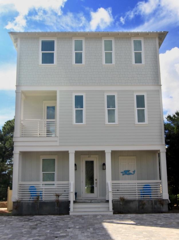 This custom home offers luxury coastal living in the highly desirable Coastal Grove development just off intersection of Hwy 393 & Co Hwy 30A. Gated entry to neighborhood offers privacy & minimal traffic, yet is surrounded by FUN! Just around the corner & a short walk to Gulf Place with restaurants, shopping, festivals, concerts, Shunk Gulley Oyster Bar, & Ed Walline park (public beach access is beautifully kept. Amenities include bathrooms, pavilion with picnic table, showers, handicap access, & free parking).
Florida Cottage design includes hardy board exterior, metal roof with exposed rafter tails, cozy front porch, & balconies in front/back. Once inside, this effect continues with charming coastal style furnishings & dcor throughout. Quality is evident with high ceilings, crown molding, porcelain plank flooring, stainless appliances, granite countertops, & intricate tilework. Every room bright, airy with many windows & unique lighting. 
Two bedrooms with full baths, bunk bed nook (which could be used as a recreation or TV area on first floor.  Open kitchen & living room on second floor.  Master Suite w gulf view on 3rd floor.  Patio made of pavers in back for cookouts and entertaining. Walk home from the beach and wash off the sand in the back patio shower.  
No HOA and no rental restrictions. 
This home has been on a vacation rental program with gross rental income of $60,000/year for two years.