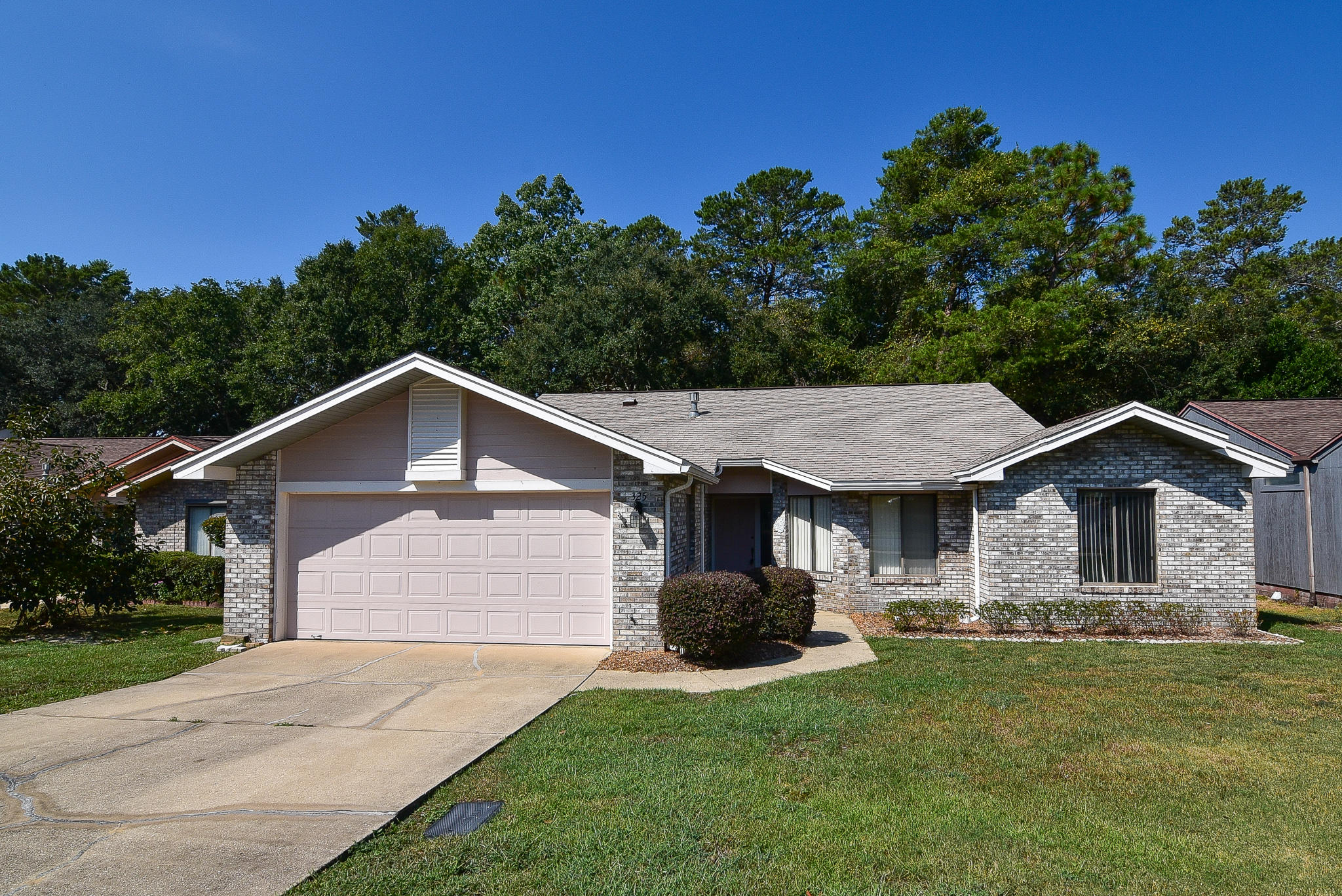 Come see this lovely home in a desirable Cedar Ridge location. Located on the 4th green of the Eglin Golf Course, Northwest Florida State College and Niceville High School are also nearby. The open floor plan features a great room with gas fireplace and sliding doors to the heated and cooled Florida room. The kitchen has wood cabinets, a pantry and has been updated with granite countertops. Washer and dryer in the utility room convey. The master bedroom also has a sliding door which leads to the Florida room as well as a large walk in closet. The adjoining master bath has double sinks and a big shower with seat. Two additional bedrooms share a full bath with tub/shower. You'll be impressed by this well maintained home that is ready and waiting for you!