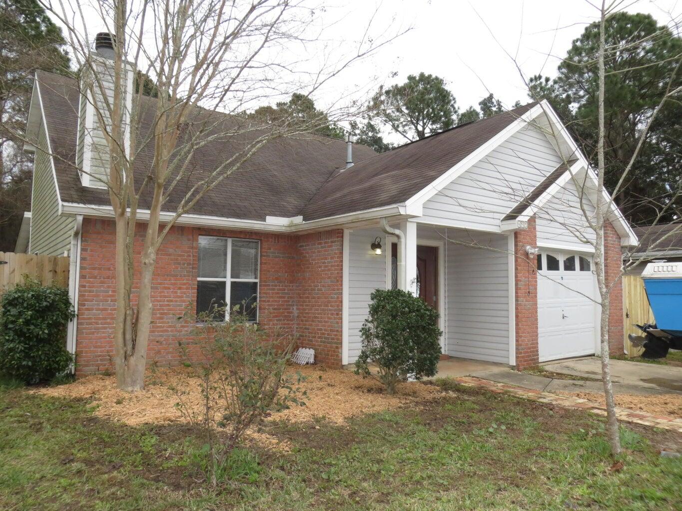 This little treasure has been freshly painted on the interior and is ready for you. This home has a corner fireplace in a large living room, kitchen with granite countertops and stainless steel appliances. First floor has a master bedroom  that leads out to a screened in porch. Another large bonus room has its own bathroom - no closet so multiple options on what you would like to use this room for. Secondary bedrooms are up stairs with a full bathroom. 2 options on where to set up your laundry area. Cute home and ready to have some awesome memories made in it. Owner will allow small to medium pets.