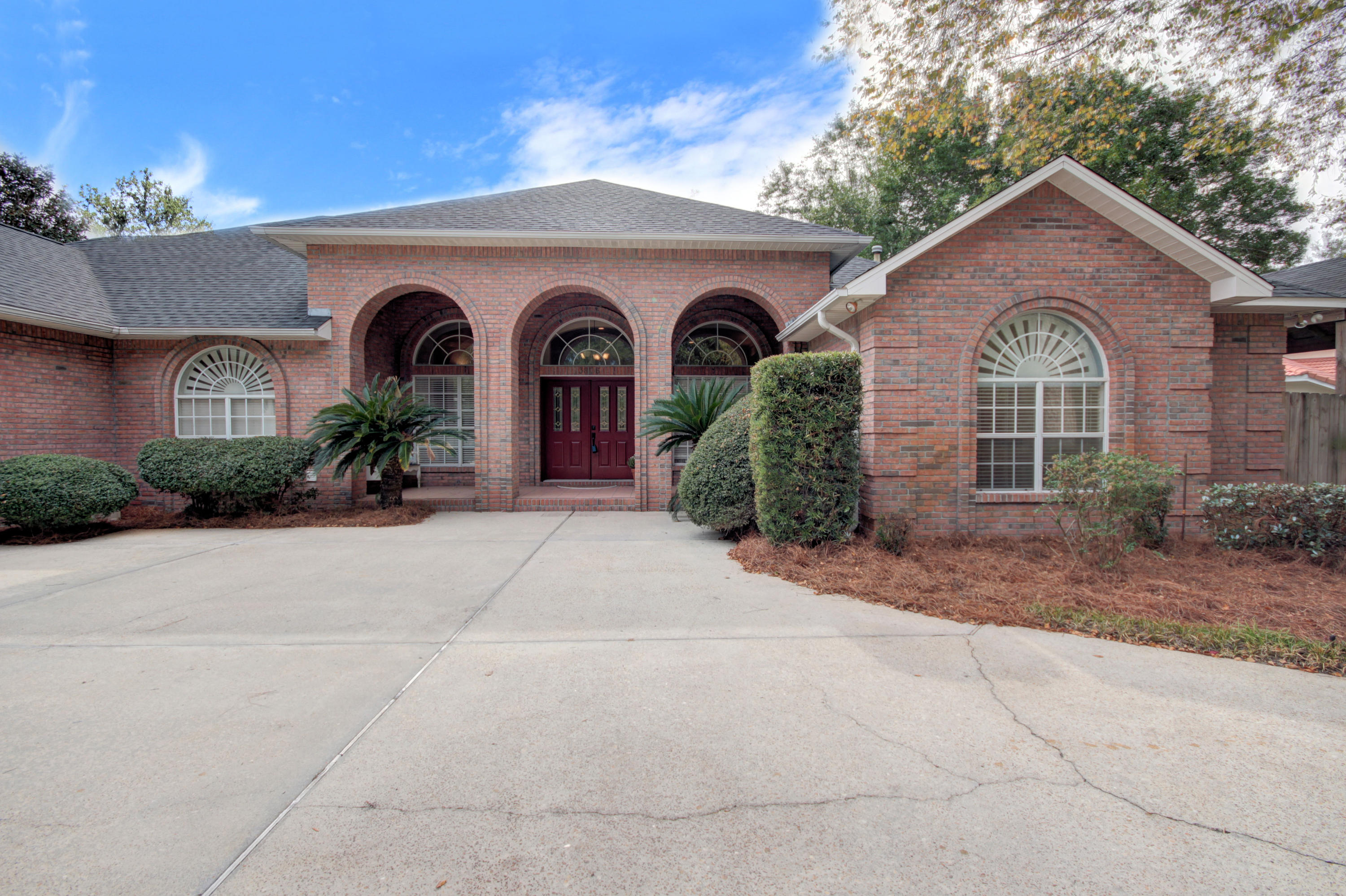 Beautiful contemporary brick home with 3000 square feet located on desirable Indian Trail. Enter a circular driveway to grand covered entrance featuring French Doors to open living/dining area defined by columns and abundant natural light from five sets of double windows. Continue to back of home to find a huge kitchen appointed with stainless appliances, stunning black granite counters, ample white kitchen cabinets, and trey ceiling. Breakfast bar easily seats 4 and Bistro table seats 4. A living/family room with cozy gas fireplace is open to the kitchen. Sliding door leads to a large covered back patio and enormous privacy fenced back yard. Split floor plan offers Master Bedroom and large ensuite bath and two more bedrooms each with own bath. Oversize 2 car garage. New roof!