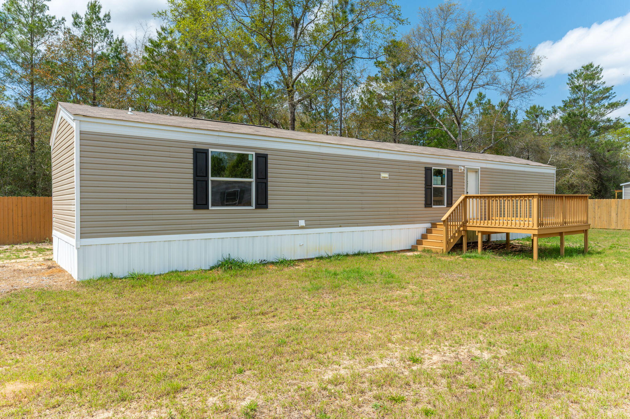 Discover this brand new mobile home in Defuniak Springs, FL. Perfect for first-time homebuyers, this charming 924 sqft residence offers 3 BD and 2 BR in a practical designed for modern living. Step outside to enjoy your morning coffee on the new front deck,. Just a short drive to beautiful Florida beaches and Airforce bases, this home balances peaceful living with accessibility to attractions and employment centers. The thoughtfully designed primary bedroom provides a peaceful retreat while the entire property delivers value and comfort without compromise. Why rent when you can own this move-in ready home with all the essentials for starting your homeownership journey? Schedule your viewing today!
Options to help with closing cost assistance with approved credit through various lenders.