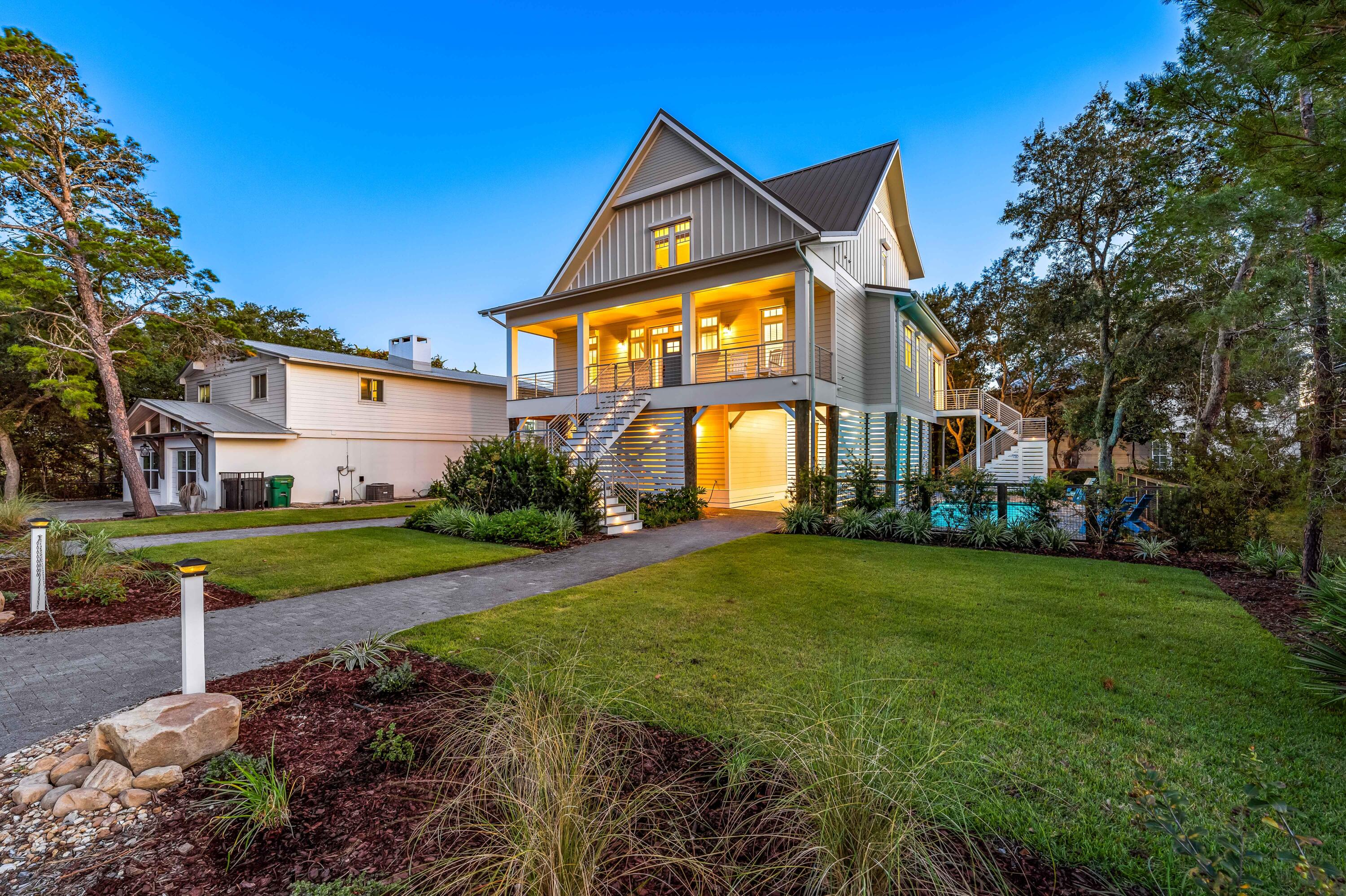 Indulge in the vibrant coastal lifestyle at 192 Betty Street - with panoramic views of the Gulf, Coastal Dune Lake and Draper Lake! This exquisite residence, constructed in 2020, seamlessly blends modern luxury with the laid-back charm of Blue Mountain Beach. Step into the heart of the home, where an open-concept main living area seamlessly integrates with the gourmet kitchen, boasting top-of-the-line Wolf, SubZero, and Cove stainless steel appliances. Whether you're entertaining guests or enjoying a quiet evening in, the coastal ambiance is ever-present. With outdoor living decks, pool and the standout feature - the rooftop deck, providing panoramic views of the Gulf of Mexico and the nearby Coastal Dune Lake, creating a perfect backdrop for social gatherings.. or quiet moments of solitude. After a day at the nearby beautiful beaches of 30A, retreat to your private pool, surrounded by lush landscaping and hardscaping, creating a tranquil oasis. The 10'x30' heated pool, ranging from 4 to 6 feet in depth, ensures relaxation year-round. Solar panels feeding Sonnen LiFeP batteries are connected to backup sub panel. Immaculately landscaped lot with irrigation (risers and drip) and a fenced back yard. Located on a quiet "cul-de-sac" with no through traffic and under 2 blocks to public beach access. With covered carport parking, ample driveway space, lockable storage, and commercial-grade hurricane shutters ensuring peace of mind, this property is not just a home; it's a sanctuary designed for both luxury, practicality and peace of mind. Convenience meets coastal charm as you explore the nearby Gulf Place, offering a myriad of dining, shopping, and entertainment options. Immerse yourself in the local culture, savoring delicious meals, exploring boutiques, and enjoying live musical just around the corner from your coastal retreat.  Discover the perfect blend of beachside elegance, entertainment, and coastal convenience at 192 Betty Street place where every day feels like a vacation, and the best of Santa Rosa Beach is right at your fingertips.