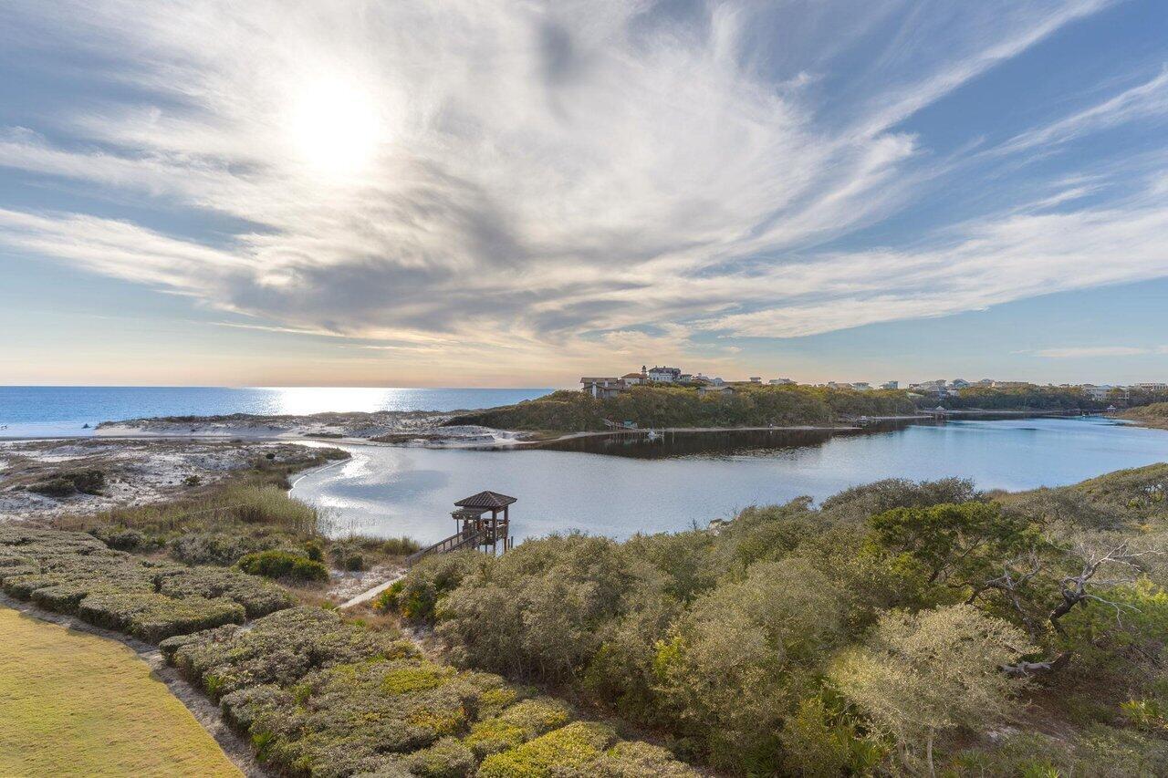 Experience the pinnacle of coastal luxury in this exceptional four-bedroom, four-and-a-half-bath residence at Sanctuary by the Sea, one of 30A's most sought-after beachfront communities. Spanning 3,163 square feet across the top two floors, this fully furnished condominium has been refreshed with new carpet and fresh interior paint, offering a move-in-ready opportunity for full-time living or a luxurious second home. Enjoy breathtaking, unobstructed southwestern views of Big Redfish Lake and the Gulf of Mexico from two expansive balconies, including an impressive 22' x 38' second-level terrace designed for entertaining and outdoor living. The thoughtfully designed floor plan features two waterfront primary suites, an open-concept living and dining area, and a chef's kitchen appointed with Viking appliances, granite countertops, custom cabinetry, dual islands, and a beverage station. Additional highlights include floor-to-ceiling windows and doors, soaring 10-foot ceilings, abundant natural light, and a spacious laundry room. Nestled on 23 gated acres between Grayton Beach State Park and Blue Mountain Beach, Sanctuary by the Sea offers an unparalleled blend of privacy, luxury, and natural beauty. Residents enjoy 650 feet of private beach access, three resort-style pools with waterfalls, fountains, hot tubs, and zero-entry access, as well as outdoor fire pits and grilling areas. A private boardwalk and dock on Big Redfish Lake provide opportunities for kayaking, paddleboarding, and fishing. Community amenities also include a state-of-the-art fitness center, golf simulator, theater room, and 24-hour security.

Ideally located just minutes from WaterColor and Seaside, this extraordinary residence offers the ultimate 30A lifestyle with world-class amenities and unforgettable coastal views.