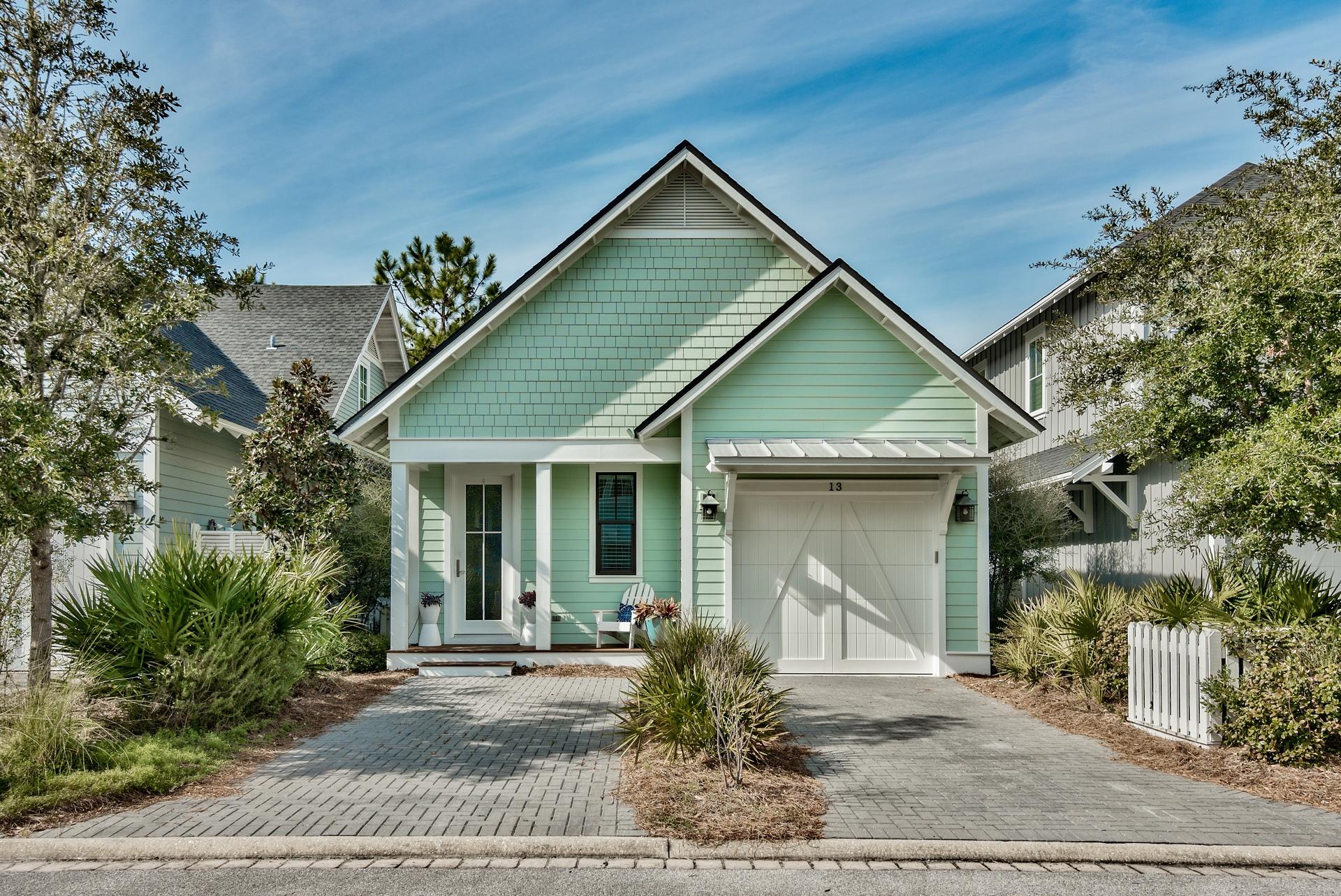 Welcome to your perfect 30a beach home! Located in the private gated community of Watersound West Beach, you will enjoy beach access to one of 30a's premier secluded beaches through Deer Lake State Park. This lovely cottage is the perfect family retreat with a spacious open great room, kitchen, and dining area that leads to a screened porch featuring a custom porch swing and outdoor dining. The master suite is conveniently located on the first floor as well as a powder room and laundry with front loading washer and dryer. Upstairs, there is a loft area which is a perfect kids retreat and doubles for a sleeping area with a daybed/trundle. Off the loft area are two more bedrooms--one with a king bed and one with a twin over full bunk bed. This beautiful home is being offered fully furnished and rental ready and features gorgeous hardwood floors, granite counters, stainless appliances,  and custom touches throughout.  There is also a single car garage!  Watersound West Beach features a community pool/clubhouse, boardwalks, two parks, boardwalk to the beach, and fitness center at Watersound Beach. Enjoy the beach life!!!