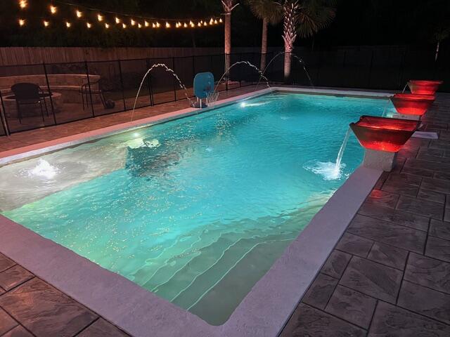 Just in time for summer fun! This spectacular residence features the amenities and quality upgrades that  buyers seek in a Florida residence!
Beautiful custom pool, massive screened porch entertainment area, firepit, large lawn and beautiful landscaping make this oasis very special. With 4 bedrooms, 2 1/2 baths and nearly $180,000 dollars invested in tasteful and life enhancing upgrades this residence is truly unique. (Please review the list of upgrades in the Documents section.)  It is located in Niceville close to shopping, churches, physicians and hospitals, services and the bay, beaches and unique recreational opportunities that makes living here so special.  No HOA to deal with, and potential to build a pool house, workshop or other amenity in the deep backyard. The interior offers many upgrades including custom storage systems in all bedroom closets and pullout storage in the kitchen. With the indoor and outdoor internet access points, you can work remotely not only all over the house, but out in the pool or on the porch as well! This home needs to be seen to be appreciated so book your showing today!