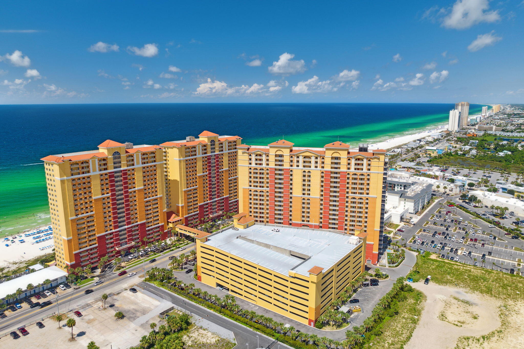 Are you looking for a 3 bedroom condo with amazing views and rentals on the books for 2024?  Nestled along the pristine shores of Front Beach, this exquisite condominium presents a rare opportunity to indulge in coastal living at its finest.  Located in the sweet spot of the 10th floor  Unit 1001 at 15928 Front Beach offers a blend of modern elegance and captivating ocean vistas, creating an unparalleled haven for those seeking a serene beach escape in the newest condominium building in Panama City Beach.  As you relax in the master bedroom and living area you're greeted by panoramic views of the sparkling turquoise waters and powder-soft sands of Front Beach. The expansive windows invite the beauty of the outdoors to seamlessly blend with the interior living spaces.  You can access the oversized balcony from the living area and the master suite.  The interior design of Unit 1001 showcases a perfect fusion of contemporary sophistication and coastal charm. High-end finishes, sleek lines, and a neutral color palette create an ambiance of refined elegance, allowing you to unwind in style.  Making this the perfect home, second home or luxury vacation rental.   The open floor plan effortlessly connects the living, dining, and kitchen areas, providing a versatile space for both intimate gatherings and grand entertaining. Natural light bathes the interior, enhancing the sense of spaciousness and warmth.  The residence boasts well-appointed bedrooms designed for comfort and relaxation. Wake up to the soothing sounds of the ocean in the lavish master suite, complete with a private en-suite bathroom and walk-in closet.  The second bedroom boasts a king bed and private bathroom.  The third bedroom is ready for the kids with the 4 bed bunk room.  Step onto your private balcony and let the gentle sea breeze envelop you as you take in the awe-inspiring sunsets over the horizon. This outdoor oasis is the perfect place to savor morning coffee or unwind with a glass of wine in the evening.   Residents of this exclusive complex enjoy access to a range of amenities, including a sparkling resort pool with private cabanas, a fitness center, on-site tiki bar and the Emerald Hub.