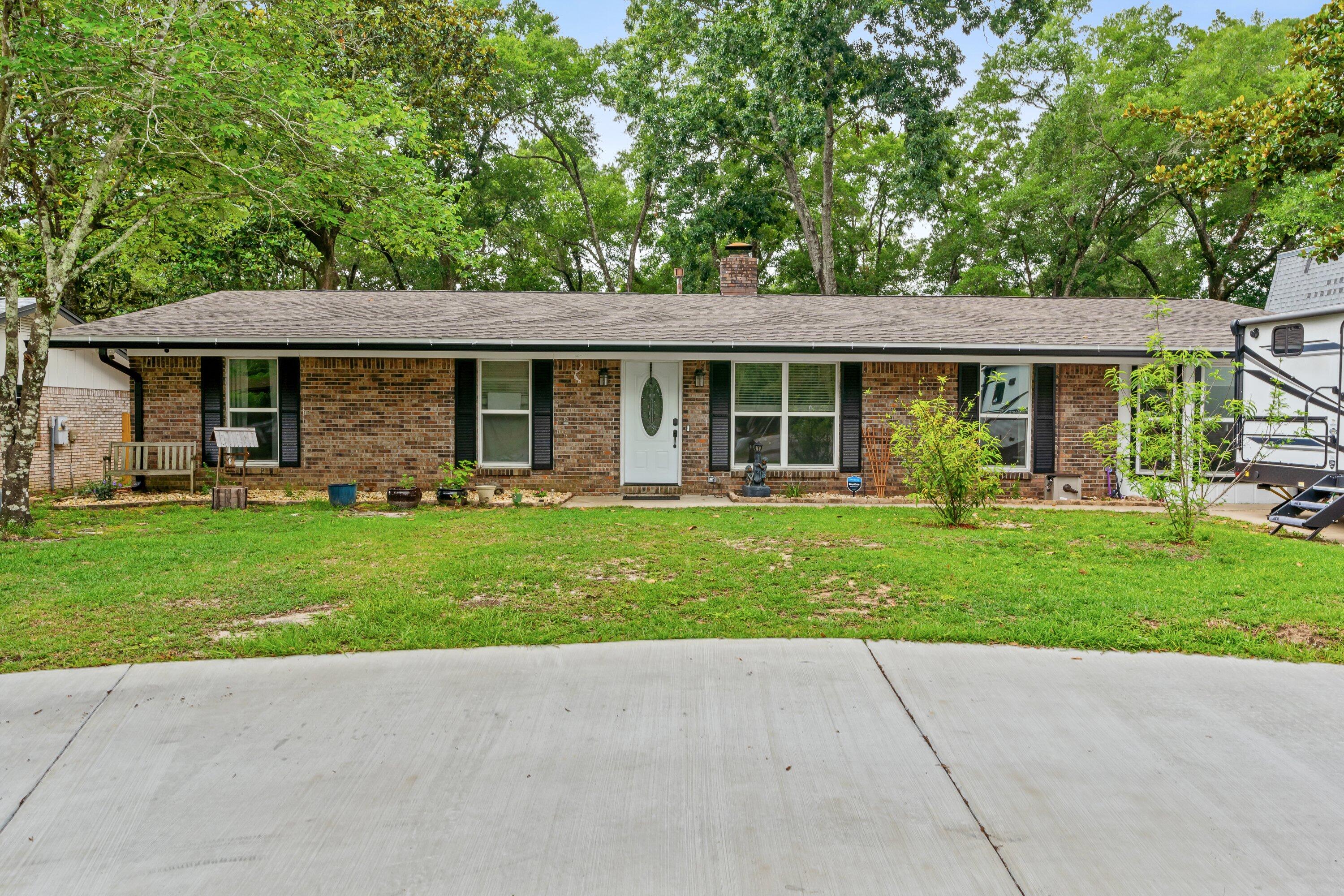 Come take a look at this spacious 4 bedroom home with fully updated kitchen featuring a fireplace, stainless appliances, granite countertops & a pantry. The kitchen has plenty of space for a table or it could be used as a family room. A separate dining room & living room adjoin.  Enjoy the ease of care with LVT flooring throughout.  The master bedroom has an ensuite bath with double vanity & tiled separate shower. Never run out of hot water again with a tankless hot water heater! The large fully fenced backyard also has a shed. Owner will consider pets with restrictions. Any pet must be spayed/neutered, housebroken and current on all shots. Requires a non-refundable pet fee. NO SMOKING! Any person at least 18 years old must apply separately. Tenants must have renter's liability insurance