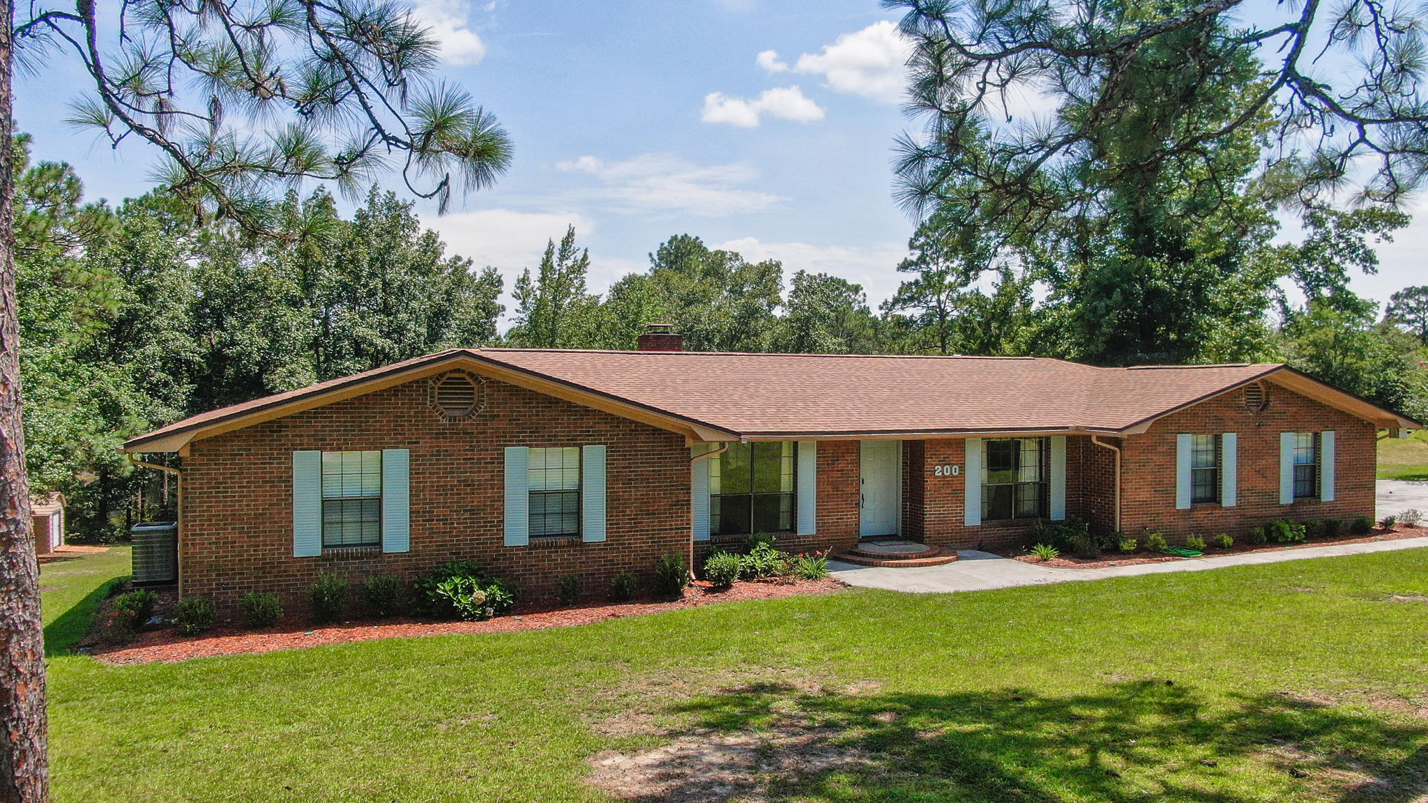 Choice lakefront estate home on 1+ acre in Ten Lake Estates in DeFuniak Springs. With room for everyone in this 4 bed/2.5 bath, the layout is ideal w/ separate entrance & privacy for a student, parent, or a roomy home office. The kitchen is well appointed w/ granite countertops & newer appliances with both breakfast area and formal dining (which could alternately be enclosed as a home office). The brick fireplace w/ heatilator is a sure winter time treat. The roomy master suite comes complete with custom built-ins. All rooms are comfortably sized. The bright, spacious sunroom may be your most cherished room! This well maintained home even has a brand new roof. Enjoy the FL sunshine on the 14x24 deck and fish right from your dock. Don't miss this rare waterfront offering with virtual tour!