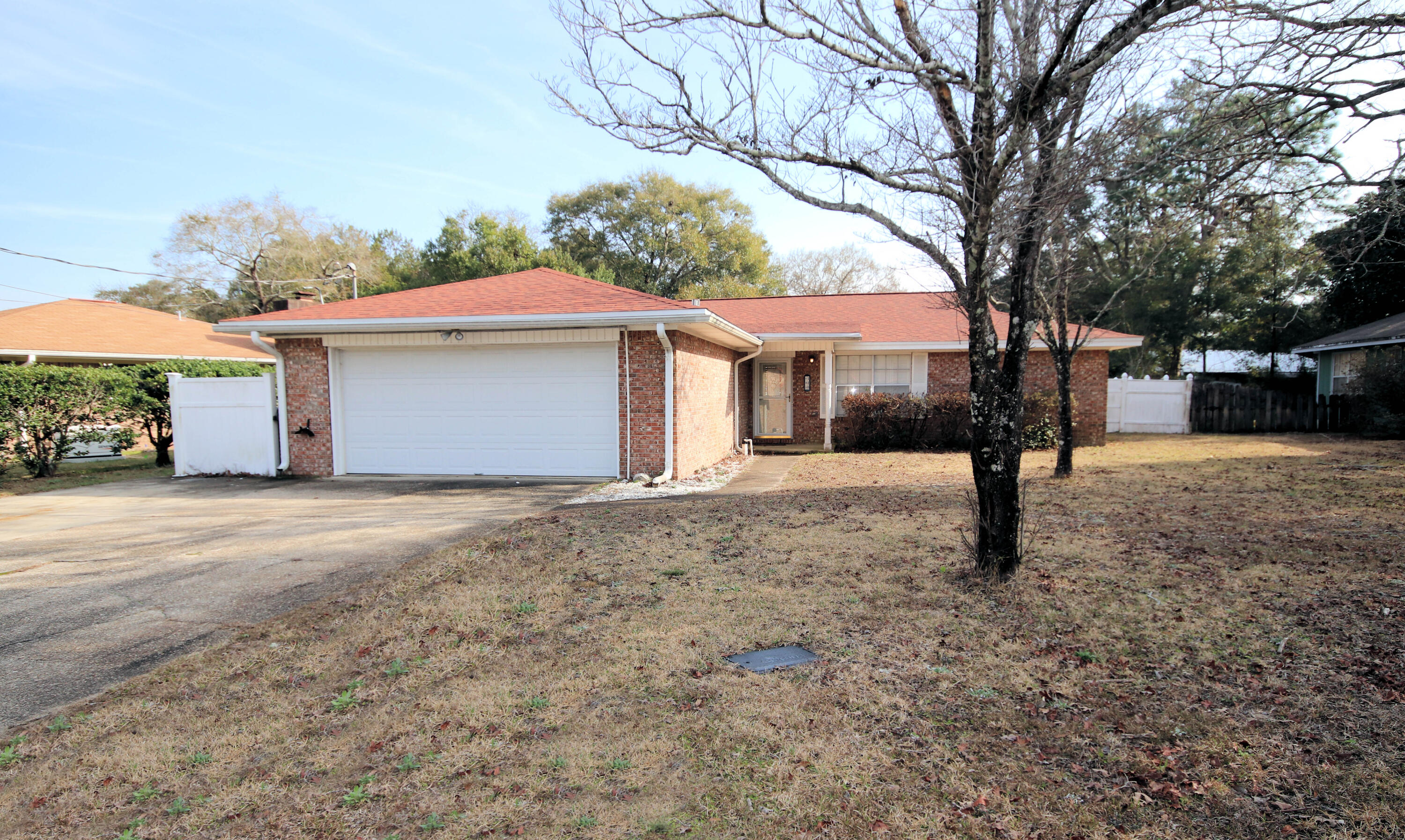 Three bedroom two bath brick ranch style home located in central Niceville. Home was just painted.  Large living room with gas fireplace and laminate floors.  The kitchen includes an eat in area,  breakfast bar, plenty of cabinets and a gas stove. All bedrooms are on one side of the home. The  primary suite has a connected bath and walk-in closet. Two additional bedrooms share the hallway bath. There are plantation shutters on all windows and laminate floors throughout. There is ample parking and a two car attached garage. The back yard is fenced and includes a shed for tenant use . All applicants 18 years or older must fill out an application @ www.nicevillerentals.com. Non smoking property. Pets MAY be allowed with owner approval and a non refundable pet fee.  Call to schedule a tour.