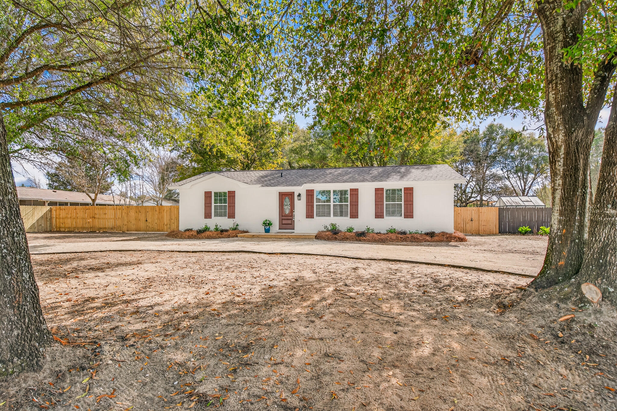 Charming and beautiful updated home on a large lot conveniently located in central Crestview. This stunning remodeled home offers stylish upgrades perfect for relaxing, entertaining, or simply enjoying every day in comfort and style. Step through the front door into a bright, open-concept living space with fresh paint, luxury vinyl plank flooring and abundant natural light throughout. The fully updated kitchen includes new stainless steel appliances, quartz countertops and modern cabinetry. Home has new roof, HVAC and water heater. The backyard is fully fenced with room for RV or boat.