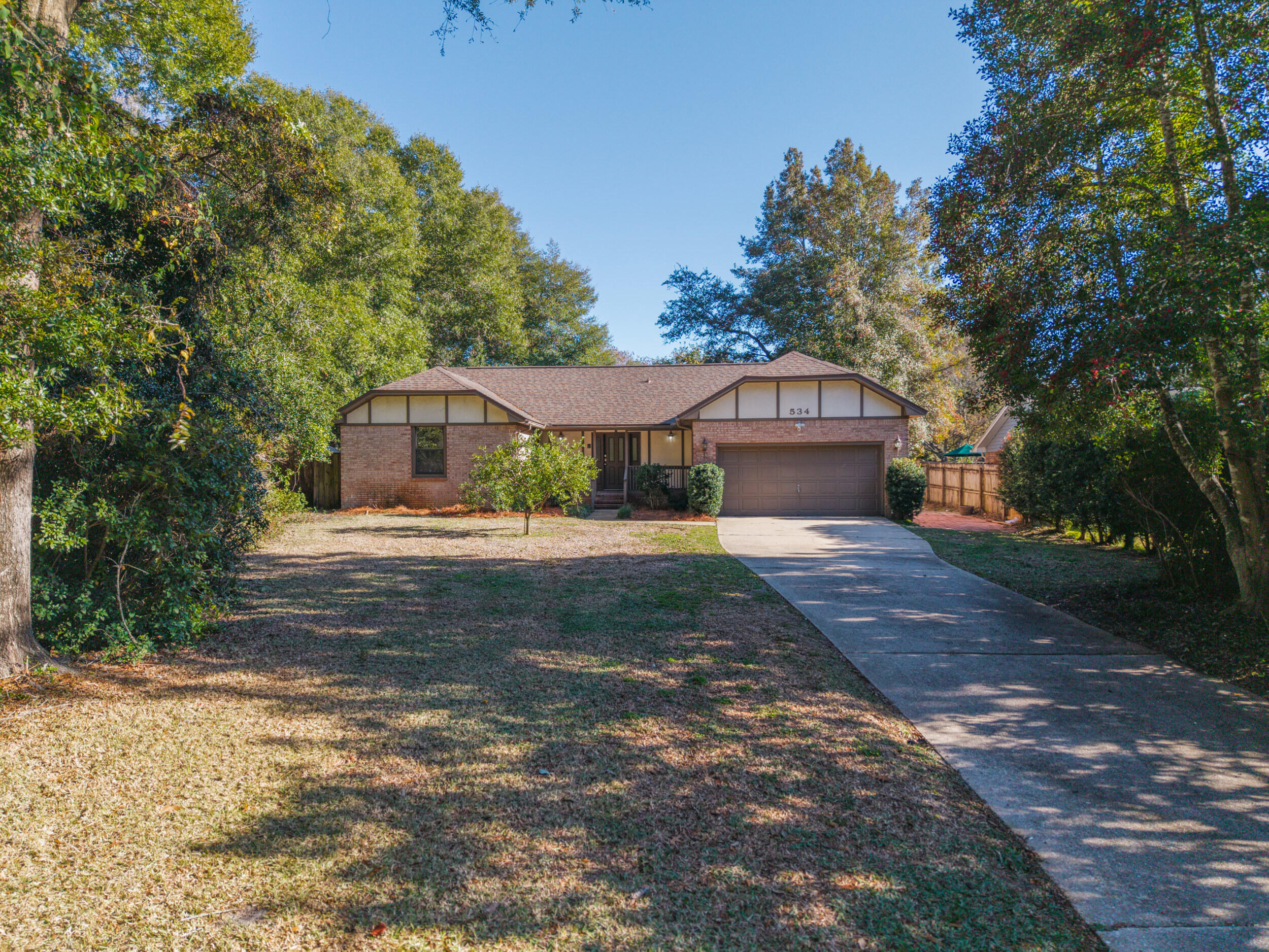*Roof-2022, HVAC-2020, Water Heater-2009* With its old-world feel, thoughtful layout, and enchanting backyard setting, this home is a rare opportunity to enjoy classic living with a touch of Florida sunshine. Step into timeless charm in this delightful three bedroom home, where classic character meets everyday comfort. Rich with traditional details and a welcoming atmosphere, this residence offers a sense of warmth that feels instantly like home.

The cozy kitchen is the heart of the house, featuring a picturesque window over the sink that looks out onto the backyard citrus trees—perfect for morning coffee and quiet moments. Just beyond, a light-filled Florida room provides a peaceful retreat for relaxing, reading, or entertaining while enjoying views of the garden Out back, mature citrus trees create a serene, fragrant oasis, ideal for outdoor gatherings or simply enjoying nature's bounty. Each bedroom offers comfortable space and enduring charm, making this home as functional as it is inviting.