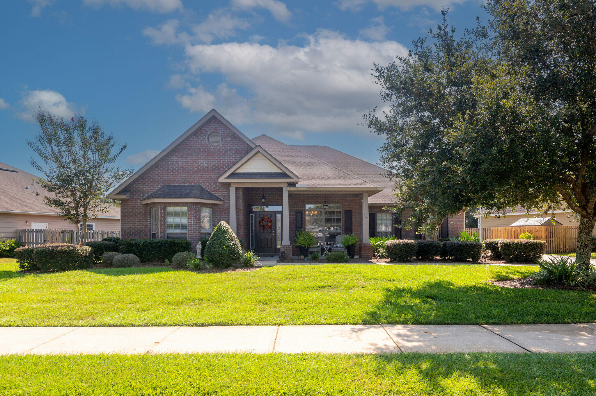 Turnkey 5/3 Lakefront home in Hammock Bay with fully fenced yard and only 22 minutes to the white sandy beaches!  This McKenzie floor plan is brilliant and in addition to 5 BRs, has a separate dining area, office, heated and cooled sunroom and backyard shed. Features and upgrades include:  granite countertops throughout, kitchen island, huge pantry, plenty of kitchen cabinets, vinyl plank floors, 9' ceilings, separate laundry with closet, large primary bedroom with spacious closet, open floor plan, double car side entry garage, natural gas hot water heater, fire pit area, inviting front porch, and irrigation system with well!  The sunroom is so inviting and perfect for relaxing and entertaining.  Hammock Bay is a street legal golf cart community and enjoys three swimming pools, owners' club with theatre and caterer's kitchen, 24/7 8,000 SF fitness center, 60 acre Sports Complex, tennis, basketball, pickle ball, dog park....too many to list!  Come enjoy the beach life in Florida at 169 Mango Lane!  Buyer to verify all square footage and information important to them.