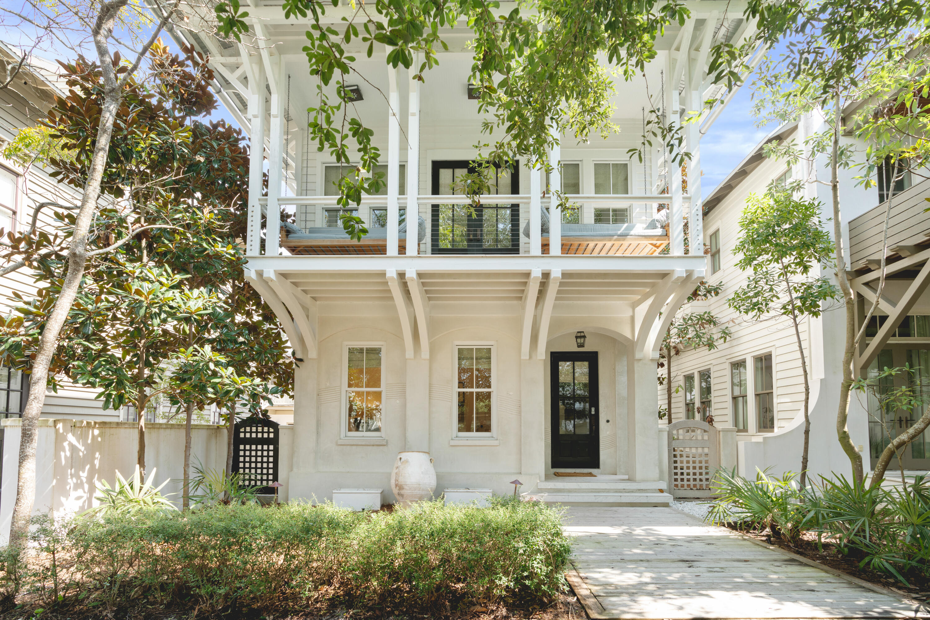 Serene, sophisticated and nothing short of sensational. This custom beach home embodies the true meaning of relaxed elegance while living up to the world class, family fun atmosphere that Rosemary Beach is known for. The spacious main house boasts four bedrooms and three baths and just across the inviting courtyard the carriage house contains two bedrooms and two full bathrooms. The first floor of this home has a comfortable den with seating for 4 and a flat screen TV, a great hangout for the kids. Off this den is a bunk room with 2 full beds, a flat screen TV and an attached bathroom with a large walk-in shower. Continuing down the hall, you will find the first king bedroom with attached bathroom. The bathroom attached to this bedroom has a vanity with granite countertops and a tiled tub/shower combination.
Head up the stairs to the second floor and you will find a powder room off the kitchen as well as a wet bar and ice maker.
The kitchen has beautiful, dark granite countertops that contrast magnificently with the natural light filling this main living space.
The kitchen has high-end appliances to make whipping up any meal a breeze.
There's also a large bar top off the kitchen and a seating area  that's perfect for relaxing and keeping the chef company while they're cooking.
Continuing with this wonderful open-concept space you will find the living room with a large, flat screen TV and plenty of seating, as well as an inclusive dining area.
There's also a master suite located on the 2nd floor. The master bedroom boasts a king bed and a private en suite.
Another wonderful feature of this 2nd floor is the large covered balcony with 2 large porch swings. This is the absolute perfect spot to relax with a book, simply enjoy the fresh air, or take an afternoon nap after a day at the beach.
Take the stairs up to the 3rd floor and you will find another lounging space with flat screen TV, and chaise lounge. This floor also has 2 queen bedrooms and a shared full bathroom with double vanity and tub/shower combination.
Continuing on to the newly renovated carriage house, you'll find it beautifully appointed and with a large open living space complete with a comfy sectional couch and flat screen TV.
There's also a dining area plus a well-equipped kitchen.
The carriage house has a queen bedroom with an attached bathroom, including a granite vanity and tub/shower combination.
Take the spiral staircase up and you will find a sleeping loft with a king bed.
There is also a second bathroom off this space with a granite vanity and glass walk-in shower.
Located steps from the Rosemary Racquet Club, Fitness Center and spectacular private Rosemary Beaches, this property would make an exceptional rental investment or 2nd home. Contact us today to see it for yourself.
Please verify all information deemed important.