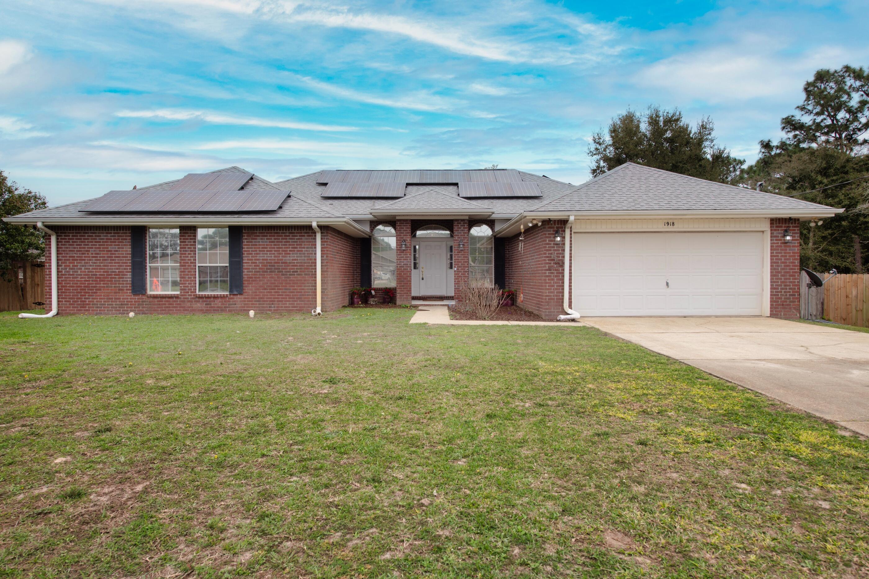 Spacious home in Navarre. As one walks through this well sized home, they will see a formal dining room on right and a large office on left. Continuing through into a grand living room area, a massive eat in kitchen with granite countertops, coffee bar, built in wine refrigerator, island, farmhouse sink, and white cabinets. The laundry features plenty of storage as well as a spacious pantry. This home is extremely energy efficient featuring solar panels as well as energy efficient appliances and lighting throughout. The additional bedrooms are all well sized with oversized closets for additional storage, the primary bedroom is also well sized, along with the renovated primary bathroom which features a separate tub shower, double vanities, and good-sized walk-in closet. Additionally, this home features easy access to Highway 98, a large Florida room, oversized two car garage, huge fenced in backyard with wooden deck and privacy all around, perfect for outdoor entertainment. This home includes extensive number of upgrades listed in sheet attached! Schedule a walkthrough today.

Home located in Holley by the Sea with access to pools, tennis courts, beach house, playground, gym, sauna, boat ramps, and access to sound. 

*Sidewalks currently being added; bottom of driveway being redone by county.

SELLER PAYING OFF SOLAR PANELS AT CLOSING unless negotiated otherwise.