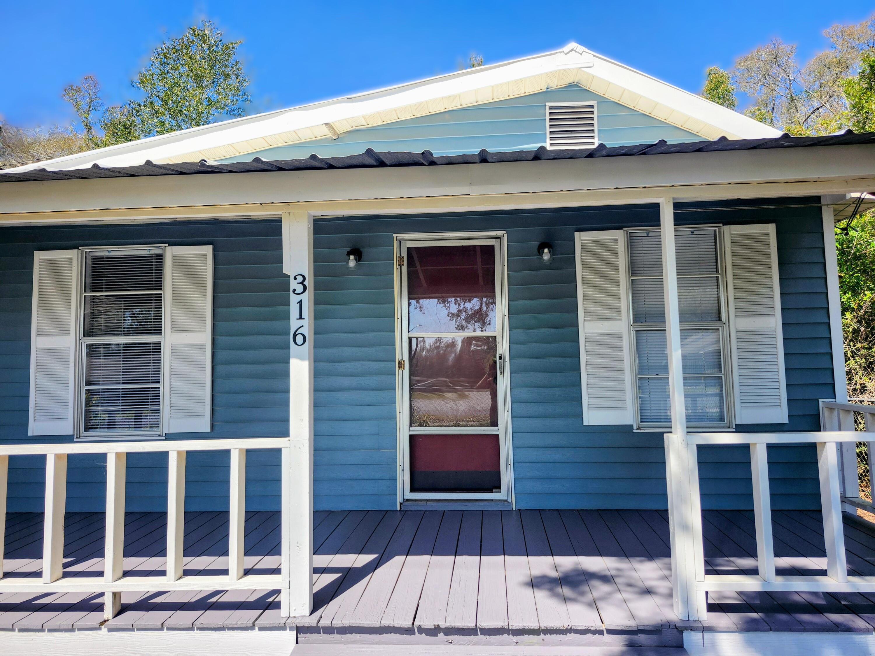 Charming home in DeFuniak Springs city limits, your perfect retreat! This .43 acre property offers quite a bit of privacy for it's central location. It is fully fenced and the healthy tree line surrounding the property offers awesome coverage! This small but fierce home is packed with practicality and flair! This gem is absolutely move in ready and waiting for someone to enjoy its new vinyl flooring and brand-new appliances! The covered porch is perfect for a hot cup of coffee and a couple of rocking chairs. Just starting out and looking for low expense living? Downsizing? Looking for a central hub for visiting our nearby beaches? This home is ready to be yours!