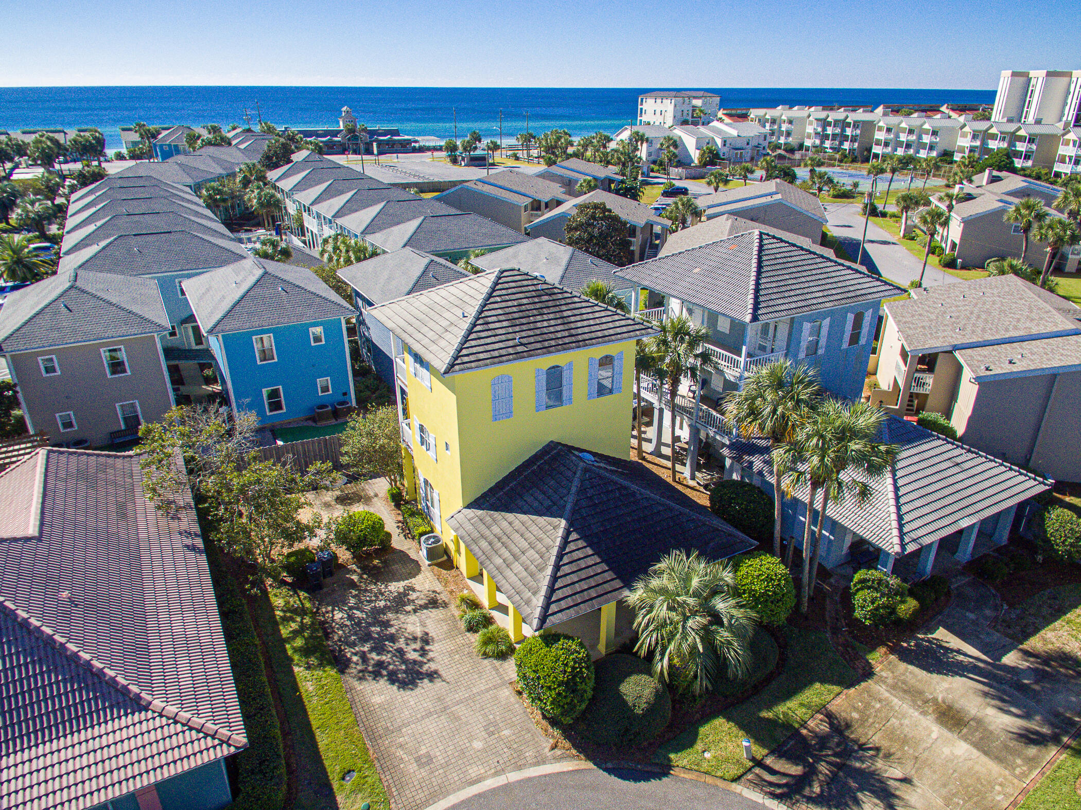 Smart Investment Opportunity! This property may qualify for a cost segregation study after closing, offering the potential for accelerated depreciation and a tax deduction of up to 10% of the purchase price—a valuable benefit for investors. Welcome to 39 Topaz Cove, a fully furnished coastal retreat nestled on a cul-de-sac in the sought-after, golf cart-friendly community of Miramar Beach! Just a 5-minute walk to private deeded beach access with restrooms and a seasonal snack bar, this property offers an unparalleled blend of luxury, convenience, and turnkey living. This smart home features a thermostat and security cameras, ensuring modern comfort and peace of mind. Inside, the open floor plan is perfect for entertaining, with a gourmet kitchen equipped with high-end appliances, custom cabinetry, and a central island. Three owners' closets provide ample storage for seasonal items or personal belongings, making it easy to maintain a clutter-free space.
Outside, enjoy covered balconies on both the second and with gulf views on the third floor, as well as front and back covered porches for year-round relaxation. As part of this vibrant community, residents enjoy access to two inviting pools, a tennis court, and a basketball court, adding to the appeal of this exceptional home. With all furnishings included, 39 Topaz Cove is an exceptional, move-in-ready opportunity in Miramar Beach. Whether you're seeking a full-time residence, vacation home, or rental investment, this beautifully appointed property provides the ideal beach lifestyle in a quiet, friendly setting. Don't miss your chance to call this slice of paradise your own!