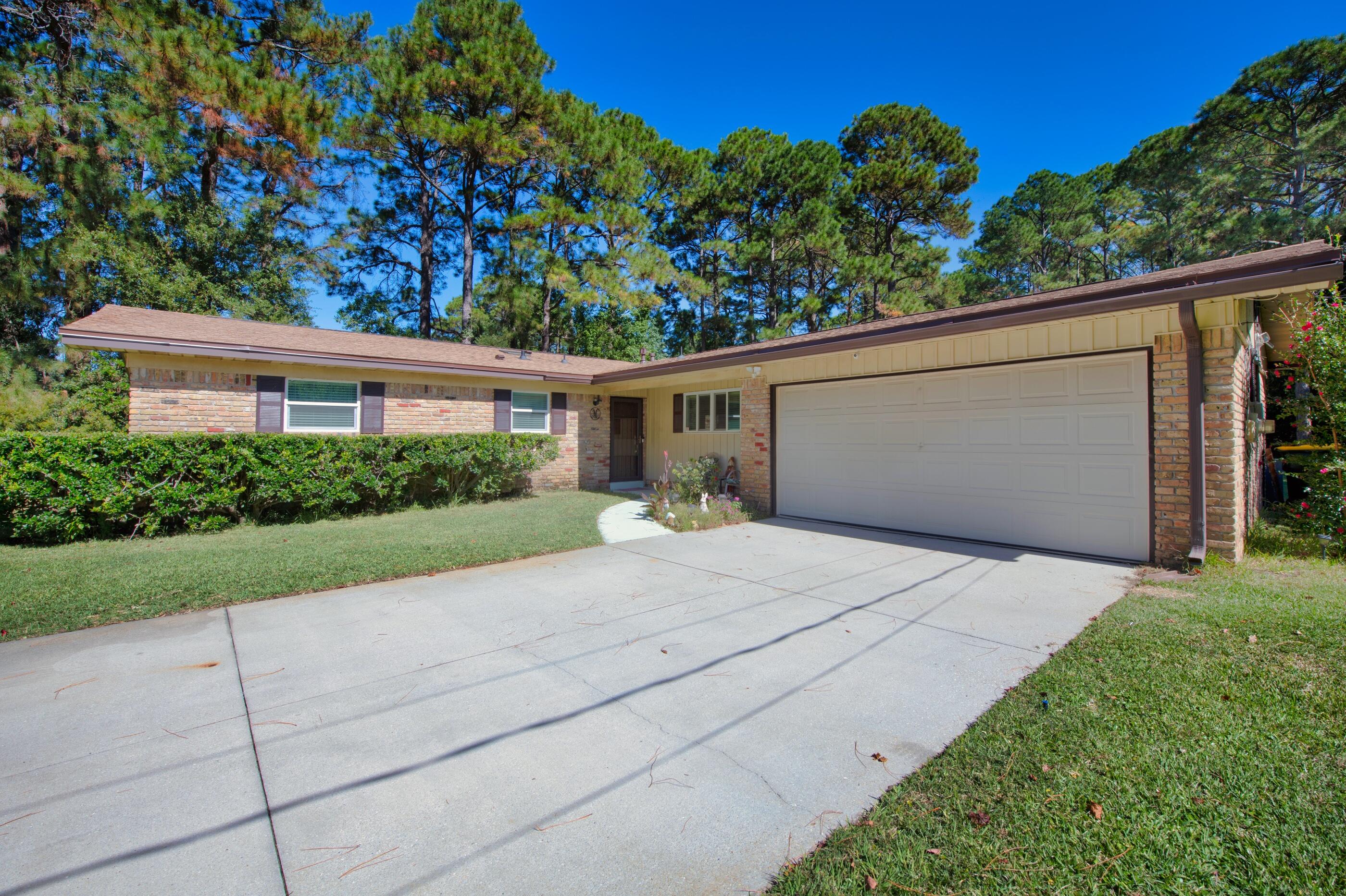 THIS IS THE ONE!  This renovated ranch is a true VALUE.  Save time and money being so close to everything.  This lovely home sits on a whopping half acre in the center of town and backs up to a city park and walking trail.  You will appreciate the hurricane protection and updates that have been done like, new roof, new kitchen with gas range & granite, new flooring combined with vintage hardwood parquet, ductwork replaced,  impact windows & a new sliding door, new lighting, renovated master bath, new lawn pump, hot water heater, AND MORE... (see list attached).  This home features an easy living floor plan.  You and your guests will enjoy the large living room, eat in kitchen and screened porch and patio area.  End your day with a glass of sweet tea out back!  Space for the RV or boat too! is open to and would prefer a lease/rent after closing.  Ask for details.   Recent Wind Mitigation and 4 Point is available too.
Don't delay - make an appointment to see this home!  Some more details: 
Screened porch added out back.  Insulated and air conditioned garage. Ring security system with full exterior video. Sliding glass doors onto patio have a roll down blind for hurricane and security protection.  The 12x20 shed/workshop is wired and can handle all your storage or hobby needs. Be sure to read the pictures and documents for more info.
