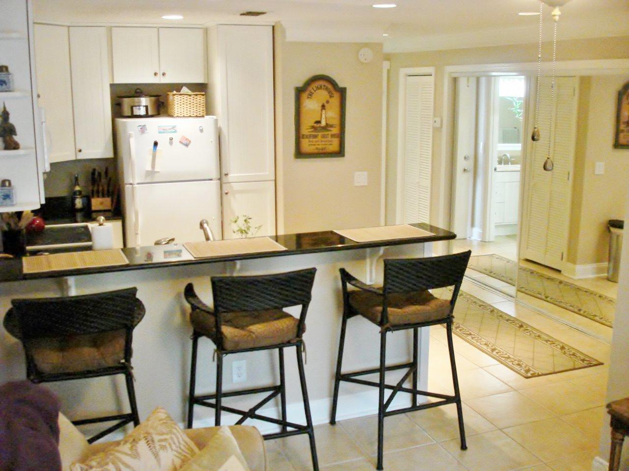 New Roof & Exterior Paint LOWEST PRICE ON HOLIDAY ISLE. Enjoy the Holiday Isle Lifestyle in this condominium with upgraded cabinets in kitchen & bath, granite countertops in kitchen & bath, tile through-out and optimized floor plan. Equipped with its own washer and dryer for convenience. Ready for permanent/ second home or rental. Close and convenient to everything that Holiday Isle and Destin has to offer, beautiful white sand beaches with emerald waters of the Gulf of Mexico, fishing, snorkeling, walking and bike paths, restaurants, shopping and entertainment. Come see and make Holiday Isle your new home.