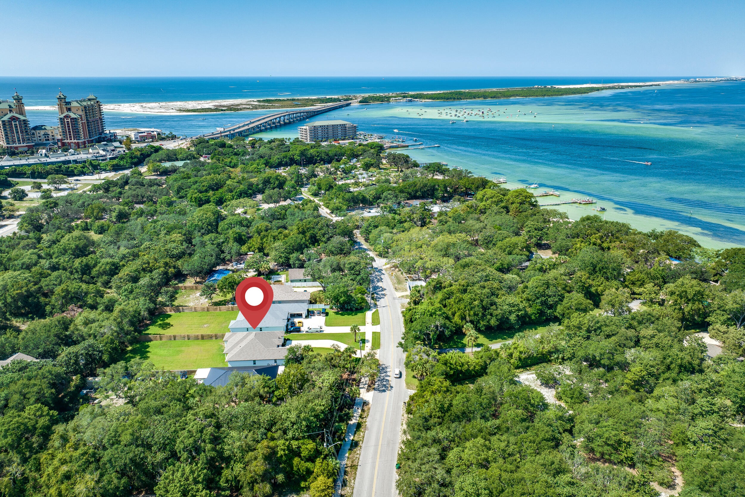 No HOA - Room for Pool - Huge Lot - Separate Office - Minutes to Harbor District - Close to Boat Launch!
Spacious 4BR/3BA built in 2022 located on 0.48 Acre lot located minutes from two Destin waterfront parks & Joe's Bayou Boat Launch. Enjoy stunning views of Crab Island & spectacular sunsets across the street at Calhoun Park. Plenty of parking and no HOA so bring your boat or RV. Excellent location on the West end of Destin, within 1/2 mile to Harborwalk Village, close to beaches, schools, shopping, restaurants and convenient to both bases - just 13 miles to both Eglin AFB & Hurlburt Field. If you are looking for the peace of mind & the lower insurance cost of a newer build then look no further than this stunning Reiker Home! This all brick home features an excellent layout with a split floorplan, private office, separate dining room, covered back porch, room for a pool and custom features throughout. Architectural details & quality craftsmanship like the arched entryway, exposed brick accents, rock salt concrete finish on the driveway & porches, trayed ceiling in master, beams in living room, mud room built in storage area, tongue & groove ceilings on porches, wainscotting, cottage style window/door trim, high quality wide plank LVP throughout & matching full size Frigidaire professional series Refrigerator and Freezer are some of the many touches that set this home apart. Thoughtfully laid out for convenience, the master suite encompasses the entire left wing of the home and includes a huge master closet, large laundry room, spacious master bath with his and hers vanities, freestanding soaking tub & a custom tiled shower as well as a private water closet. The guest wing features three large bedrooms and two full bathrooms with the middle and rear guest rooms sharing a Jack and Jill bath. A stunning chef's kitchen with large counter height bar, stainless professional series appliances, soft gray custom cabinetry & gaudi hex patterned tile backsplash overlooks the spacious open living room. The expansive fully fenced backyard is ready to be transformed into a tropical oasis -- with this much room, the possibilities are endless! Schedule your showing of this amazing home today. *Note tenant occupied, photos taken when vacant*