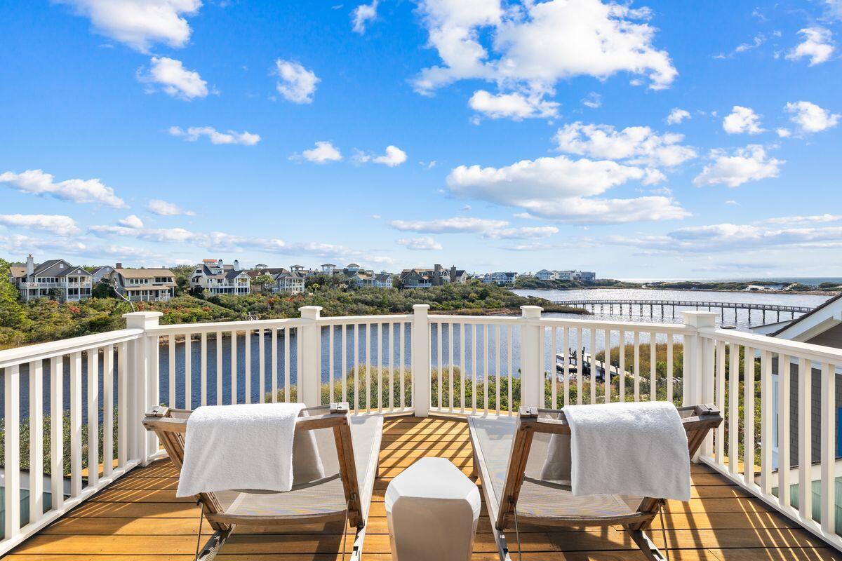 Exceptional Price, Unmatched Views - Don't Miss This Watersound Beach Beauty! This exceptional home offers a rare combination of stunning front-row views of Camp Creek Lake and the Gulf, along with the privacy, security, and tranquility discerning buyers seek. Nestled in one of 30A's most exclusive and less commercialized communities, this home is a true sanctuary for those who prioritize a quieter coastal lifestyle.

Designed across three levels, the first floor features three spacious guest suites, each with a private bath, leading to a vast screened porch with an outdoor fireplace and TV—perfect for relaxed evenings in a serene setting. The second level boasts an open-concept living, dining, and kitchen area framed by spectacular lake and gulf views, seamlessly flowing onto an expansive balcony for alfresco dining and lounging. A separate prep kitchen and dedicated grilling porch enhance both convenience and entertaining possibilities.

The third level is dedicated to a stunning master suite, complete with a spa-like bath, a custom walk-in closet, and a private porch with panoramic water views. A private elevator provides effortless access to all three floors.

Set within the secure, gated Watersound Beach community, this home offers an unparalleled sense of peace and charm. Additional features include a spacious garage with ample storage. Now available at a newly improved price, this rare opportunity to own a secluded coastal retreat should not be missed!