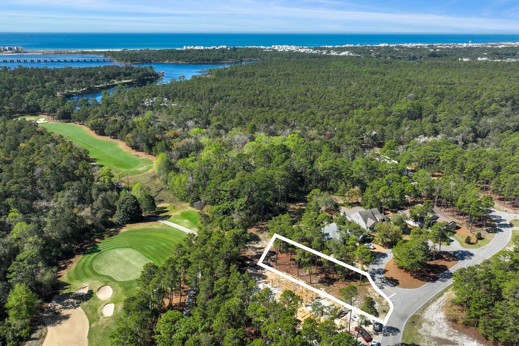 Seize the opportunity to own one of the most desirable lots overlooking the 11th green of the Greg Norman-designed Shark's Tooth Golf Course. Nestled in the prestigious, gated community of Wild Heron, this lot offers breathtaking golf course views and access to an exceptional lifestyle. This property comes with approved building plans, making it even easier to bring your dream home to life.

Wild Heron is a thoughtfully planned neighborhood situated along the scenic shores of Lake Powell, featuring architecturally distinctive Coastal Craftsman homes. Residents enjoy an array of world-class amenities, including a lakefront swimming pool, a state-of-the-art health and fitness center, and a charming lakeside boardwalk. The community also boasts a lakeside fitness center with a marina , providing access to boating and water activities. In addition, there is a family park and a lakefront boathouse fully stocked with kayaks and canoes for residents to enjoy. A network of walking trails and nature paths connects the amenities, perfect for morning strolls or sunset walks.
Ideally located, Wild Heron offers the best of both privacy and convenience. It's just minutes from premier shopping, fine dining, and the sugar-white sands of Panama City Beach, Rosemary Beach, Scenic 30A, and the Beaches of South Walton. Plus, it's only a 25-minute drive to Northwest Florida Beaches International Airport, making travel effortless. Don't miss the chance to build your dream home in this serene, amenity-rich community with unparalleled golf course views.